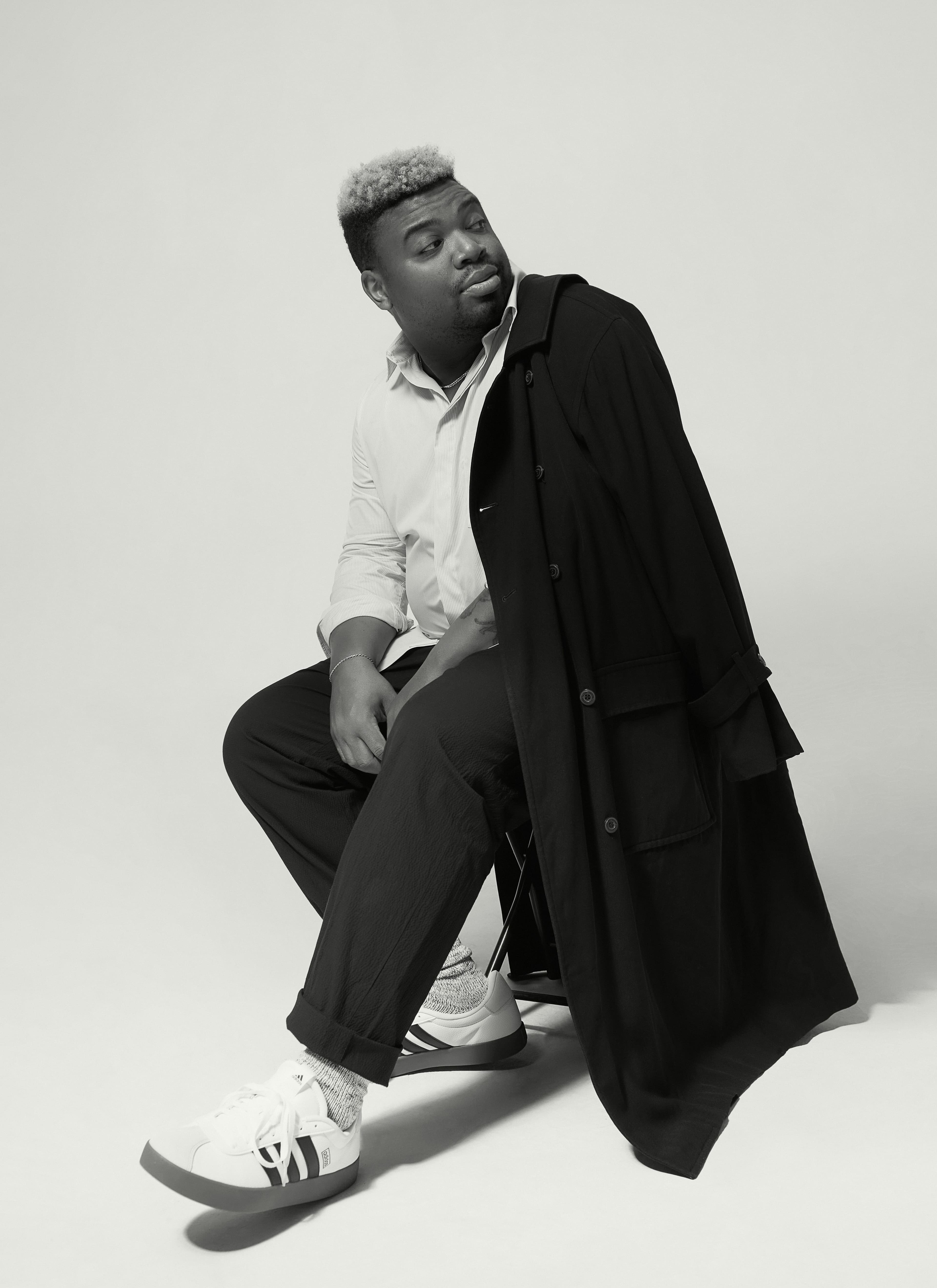 Vintage COAT by ,Dior Men. ,SHIRT by ,Loewe ,from ByGeorge. PANTS by ,Rag & Bone. ,SOCKS by ,Druthers NYC. ,SNEAKERS by ,Adidas. ,NECKLACE, Washington’s own., ,BRACELET, ,by ,Miansai,.,