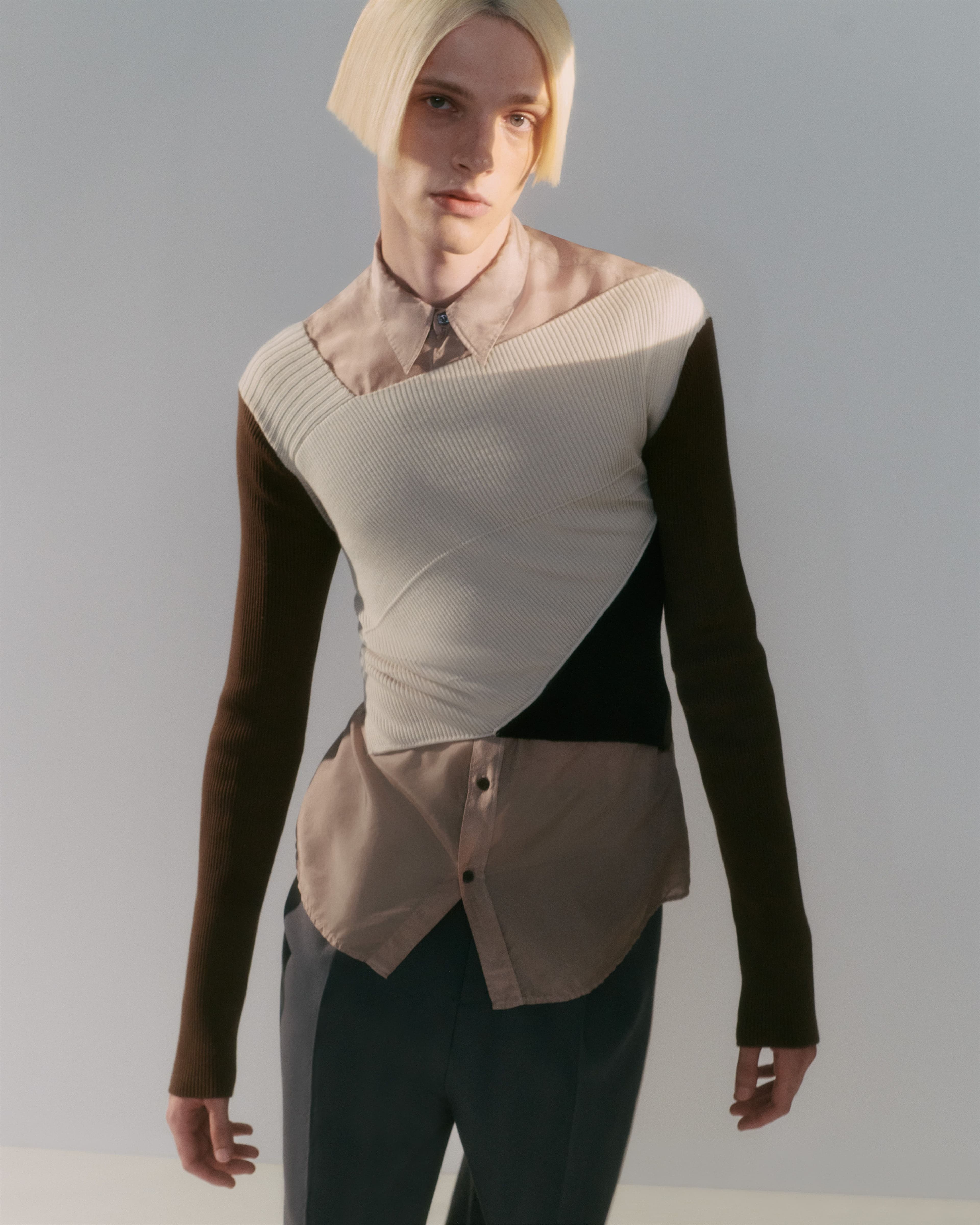 Sweater and shirt by Dries Van Noten. Pants by Gucci.