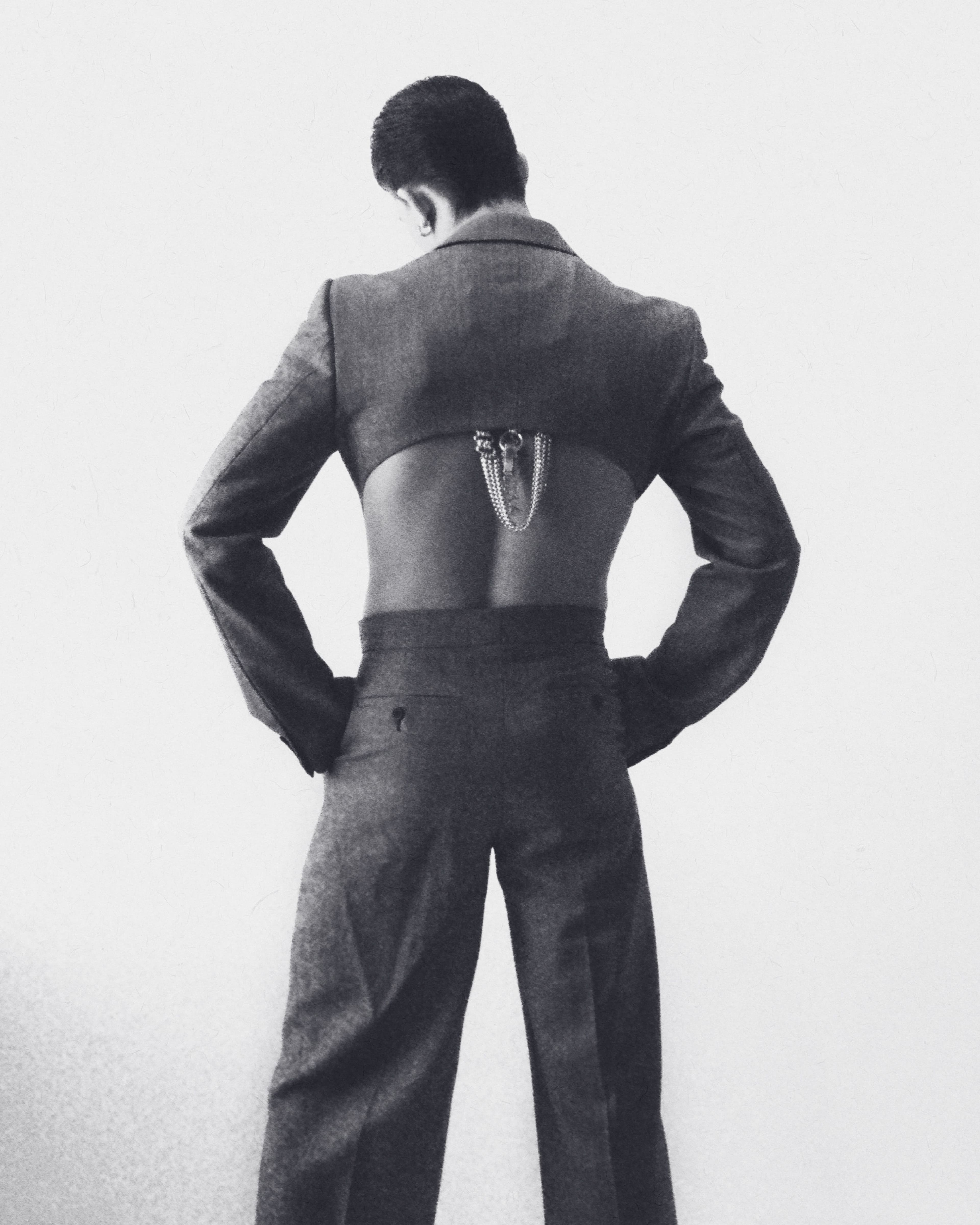 Suit by Alexander McQueen. Earrings and necklace (worn on back) Spinelli Kilcollin. Necklace (worn on back) by Martine Ali.