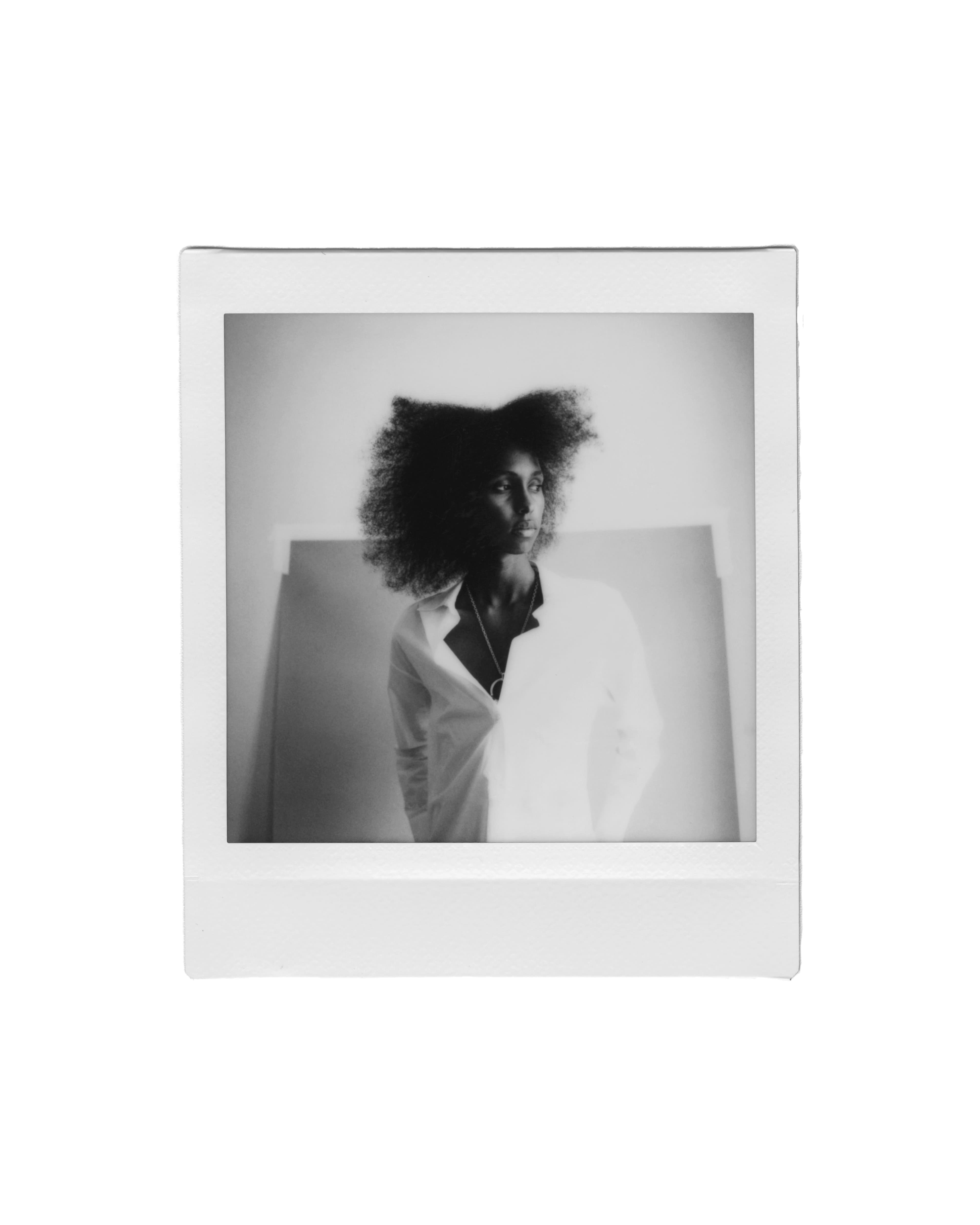 Shirt by Ashlyn. Necklace by Gucci.