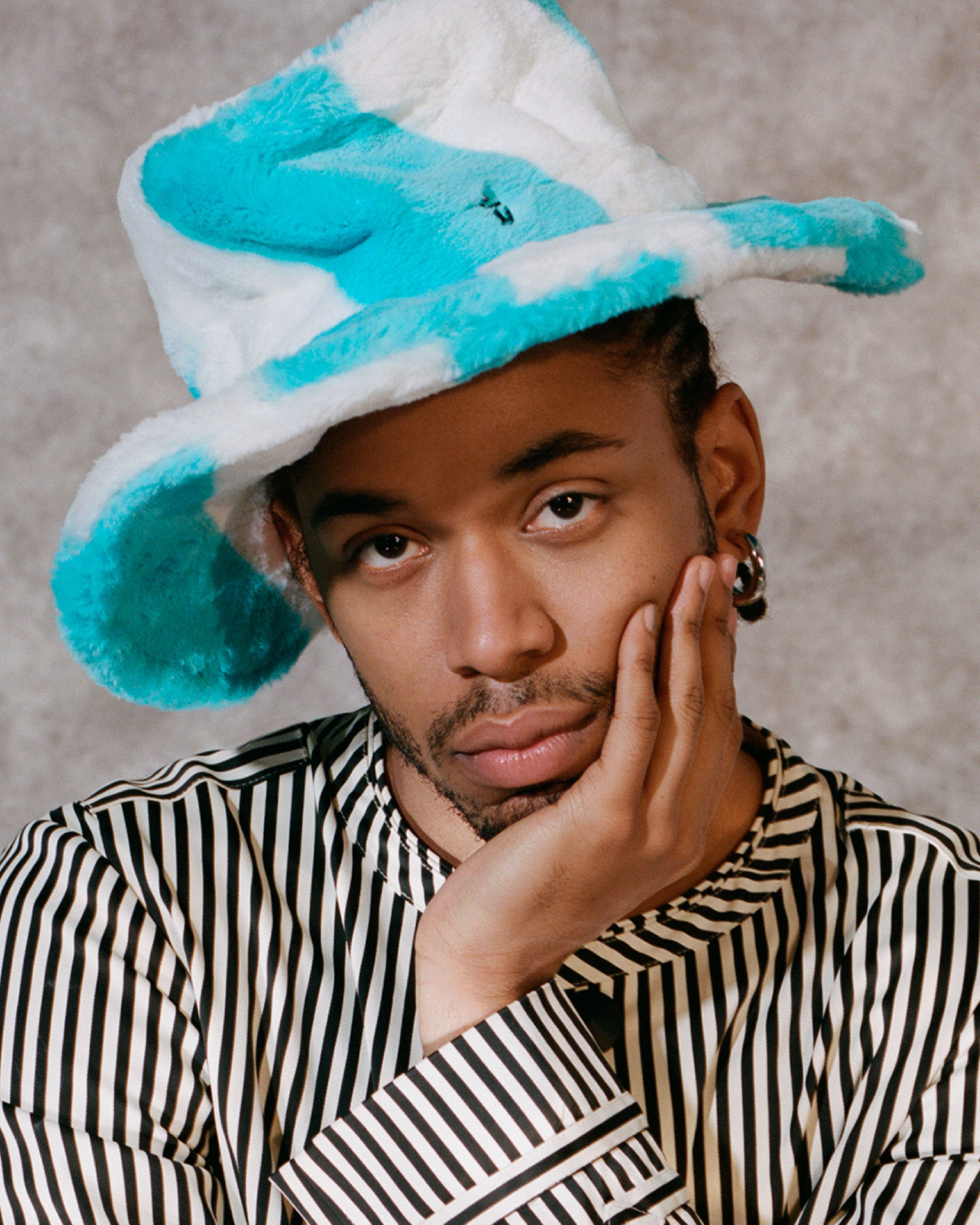 Vintage jacket by Jean Paul Gaultier from the Albright Fashion Library. Vintage hat by Maison Michel from the Albright Fashion Library.