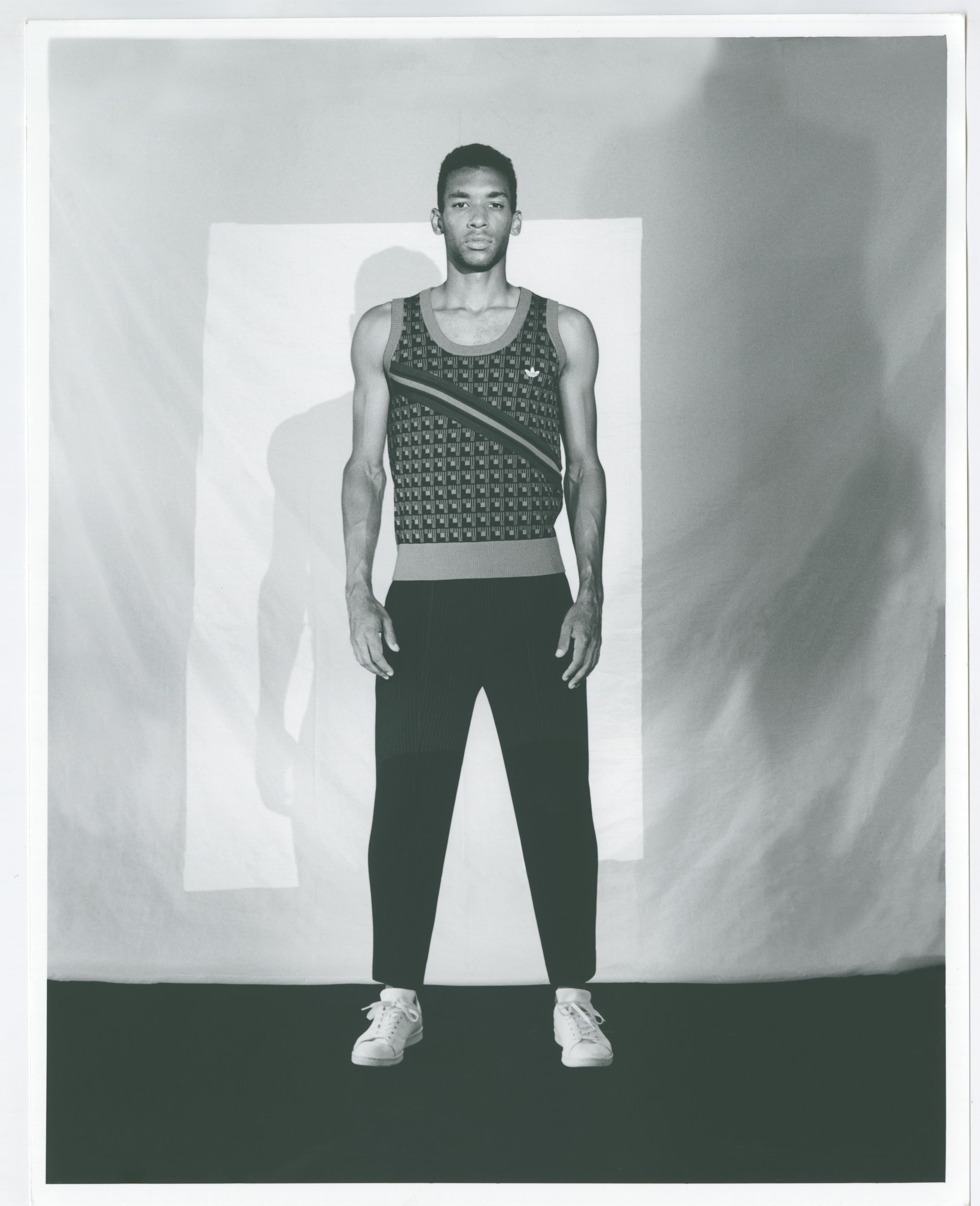 Top by Adidas Originals by Wales Bonner. Pants by Homme Plissé Issey Miyake. Sneakers by Adidas, Auger-Aliassime’s own.