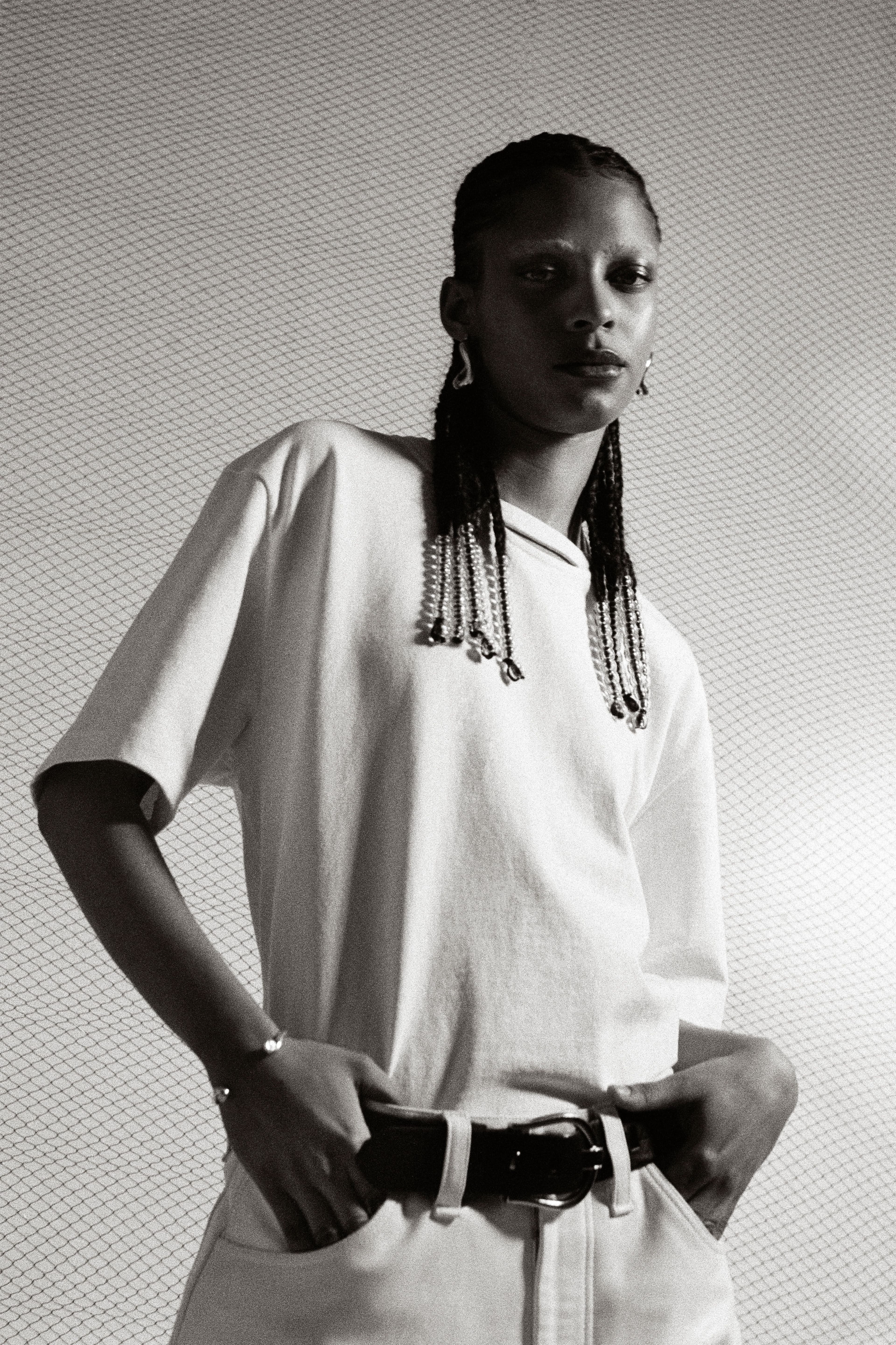 T-shirt and pants by Altu. Belt, stylist’s own. Earrings by Laura Lombardi. Bracelet by Leigh Miller.