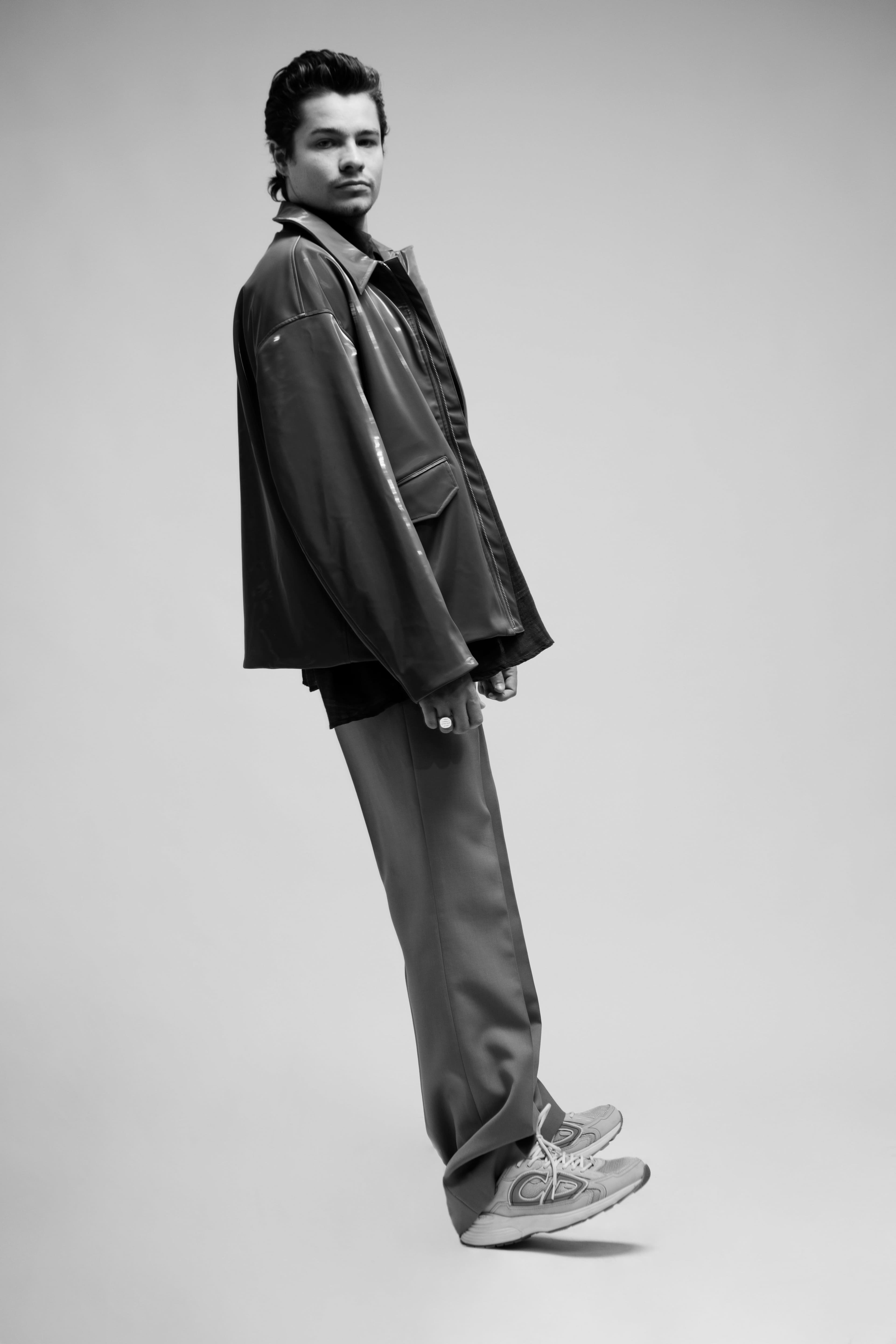 Jacket by Holzweiler. Shirt by Our Legacy. Pants by Wooyoungmi. Shoes by Dior Men. Rings by Bleue Burnham.