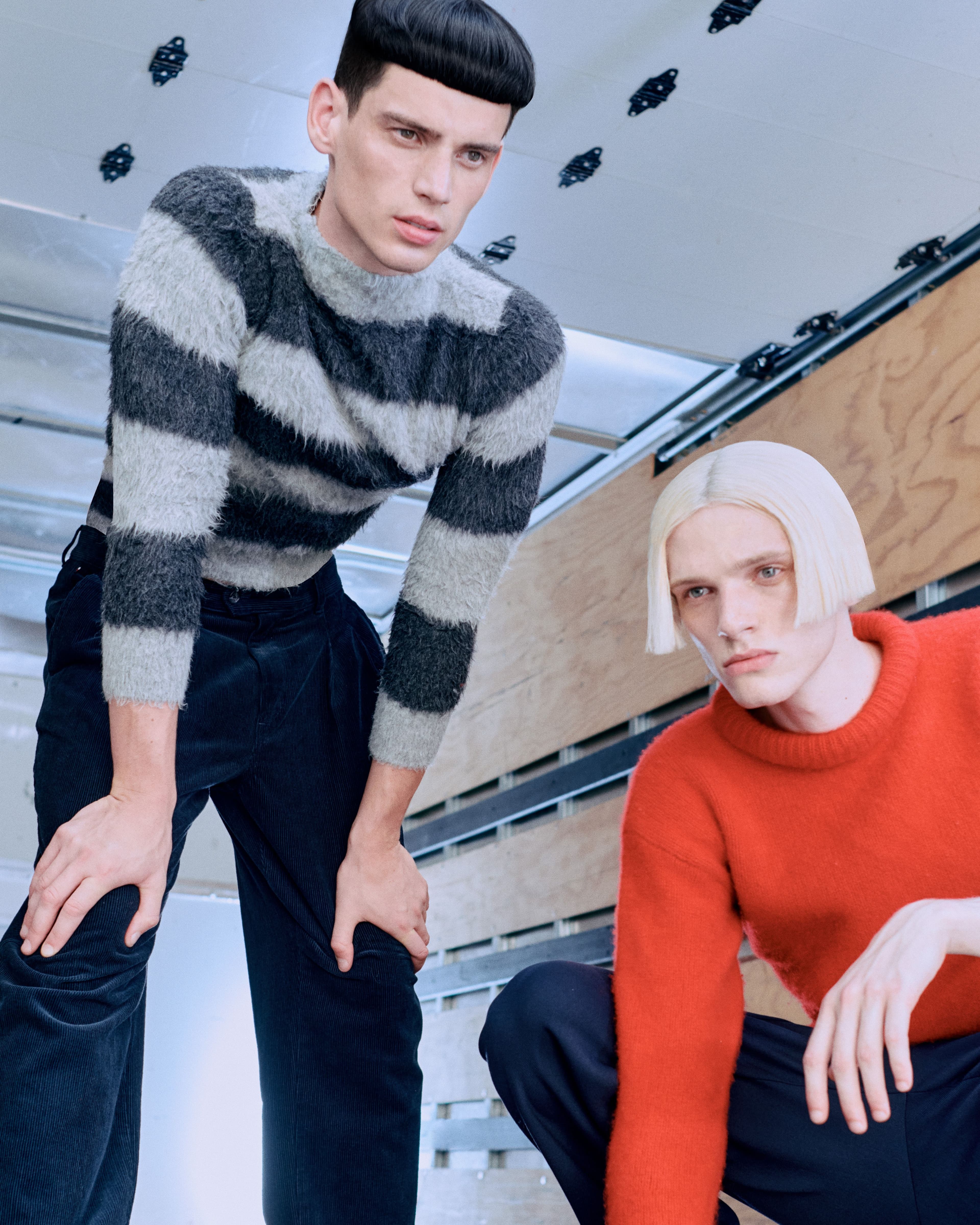 From left: Hughes wears vintage sweater from Stock Vintage. Pants by Tommy Hilfiger. Frye wears sweater by Rag & Bone. Pants by Helmut Lang.