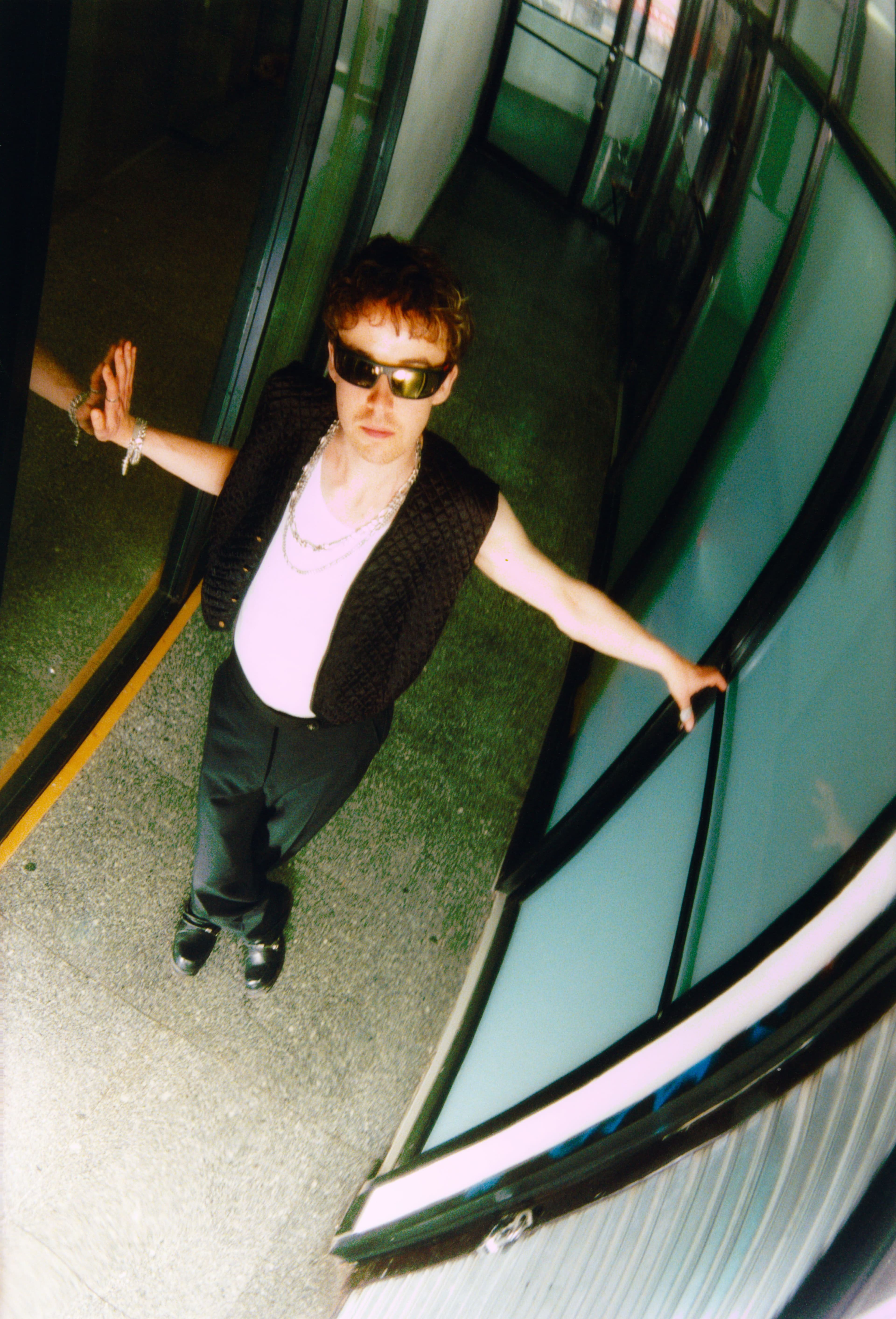 Vintage vest from Stock Vintage. Undershirt, stylist’s own. Pants by Bode. All jewelry throughout from Front General Store.