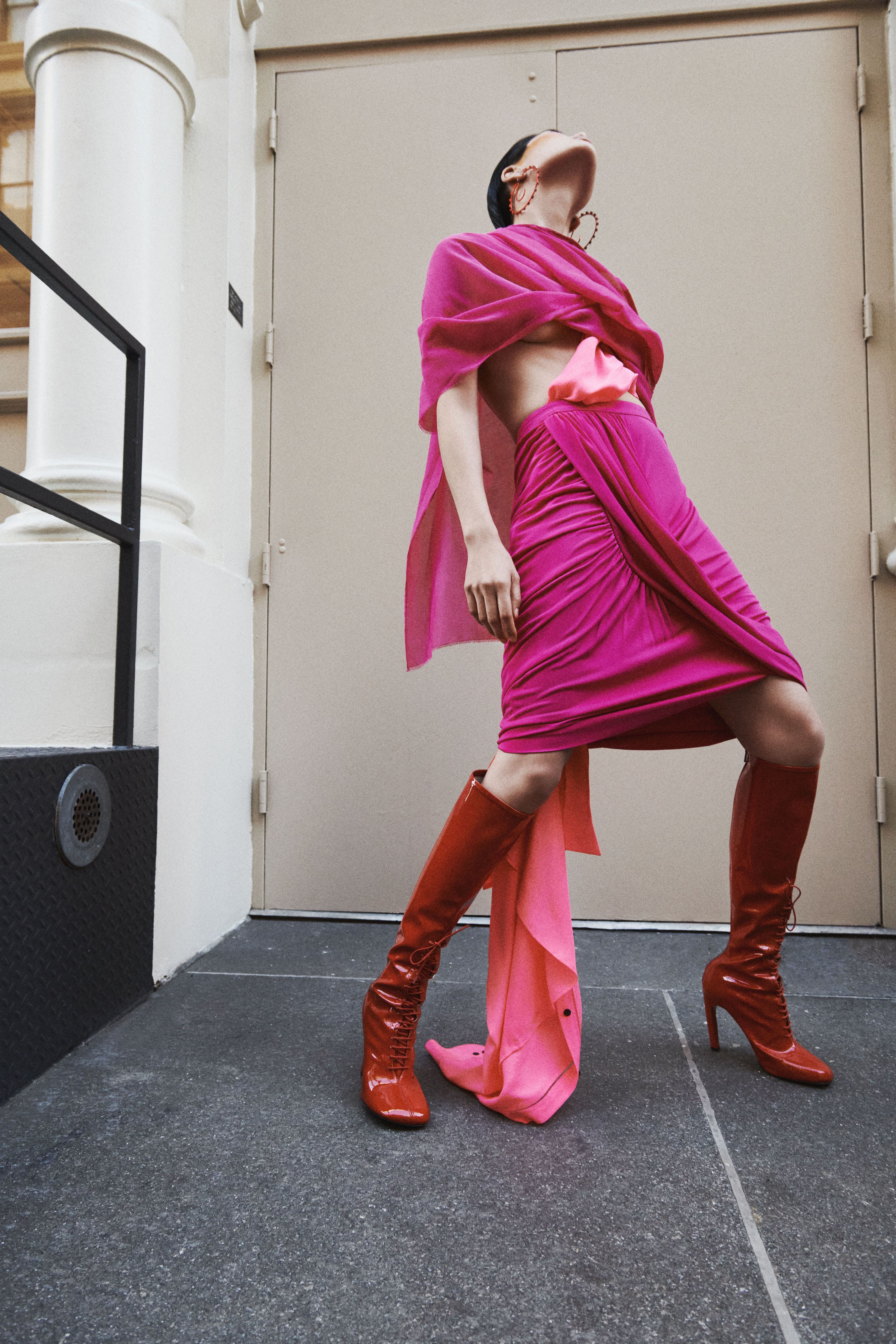 Top by Silphium Studio. Shirt, worn underneath; skirt; and boots by Dries Van Noten. Earrings by Panconesi.