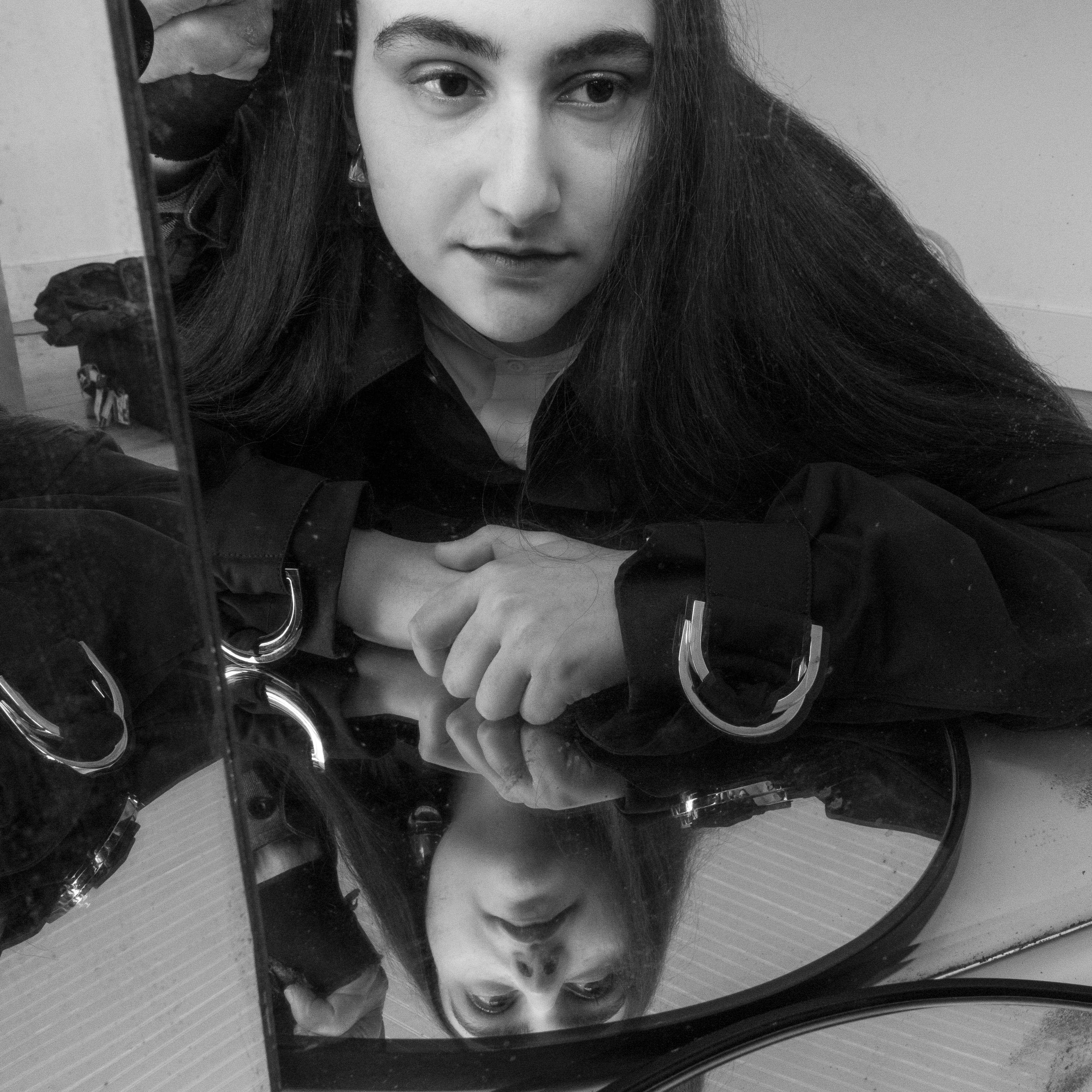 Coat by JW Anderson. Vintage shirt by Céline from the Albright Fashion Library. Earrings by Patricia Von Musulin.