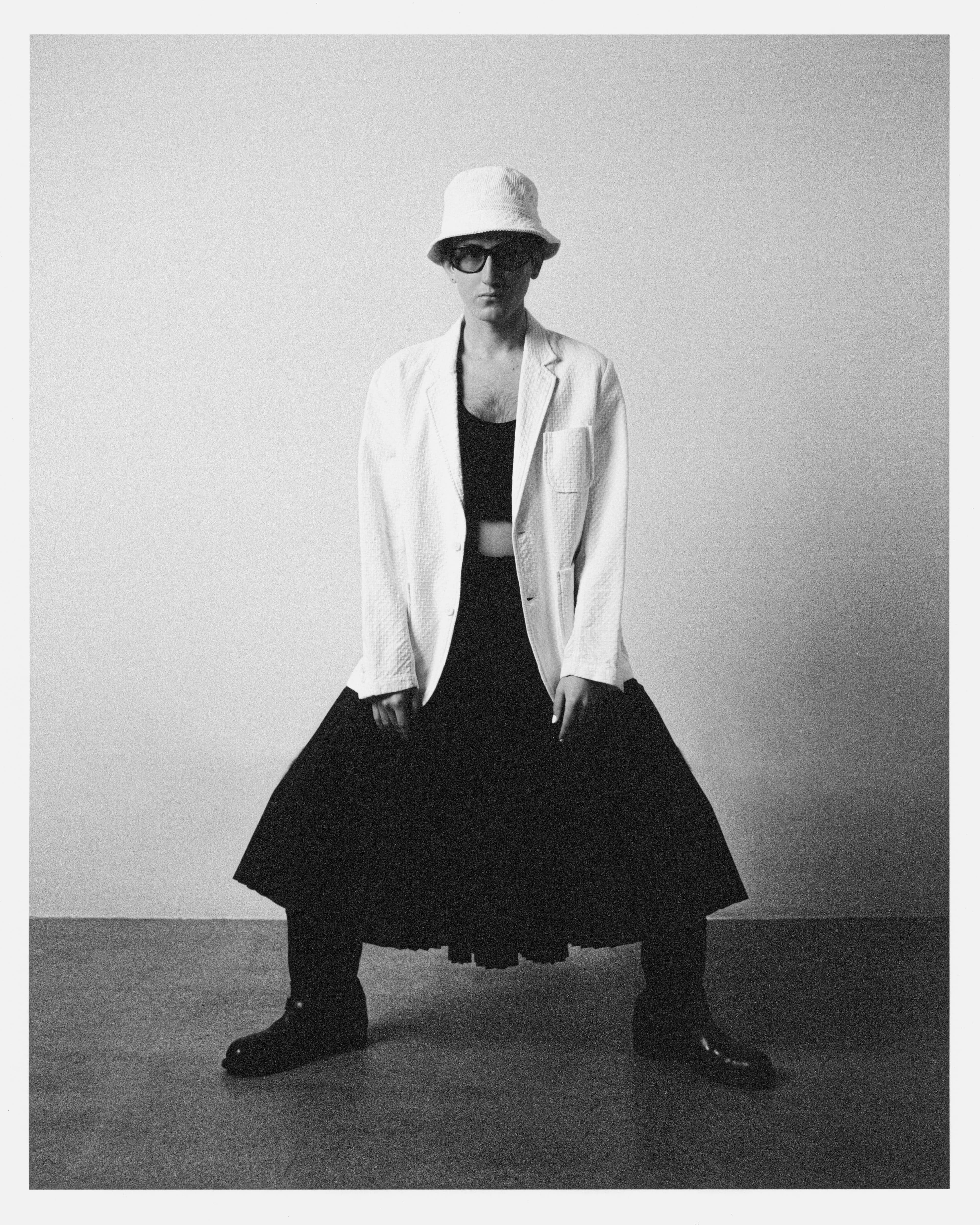 Jacket by KUON. Top by Altu. Skirt and hat from Front General Store. Vintage glasses, stylist’s own.