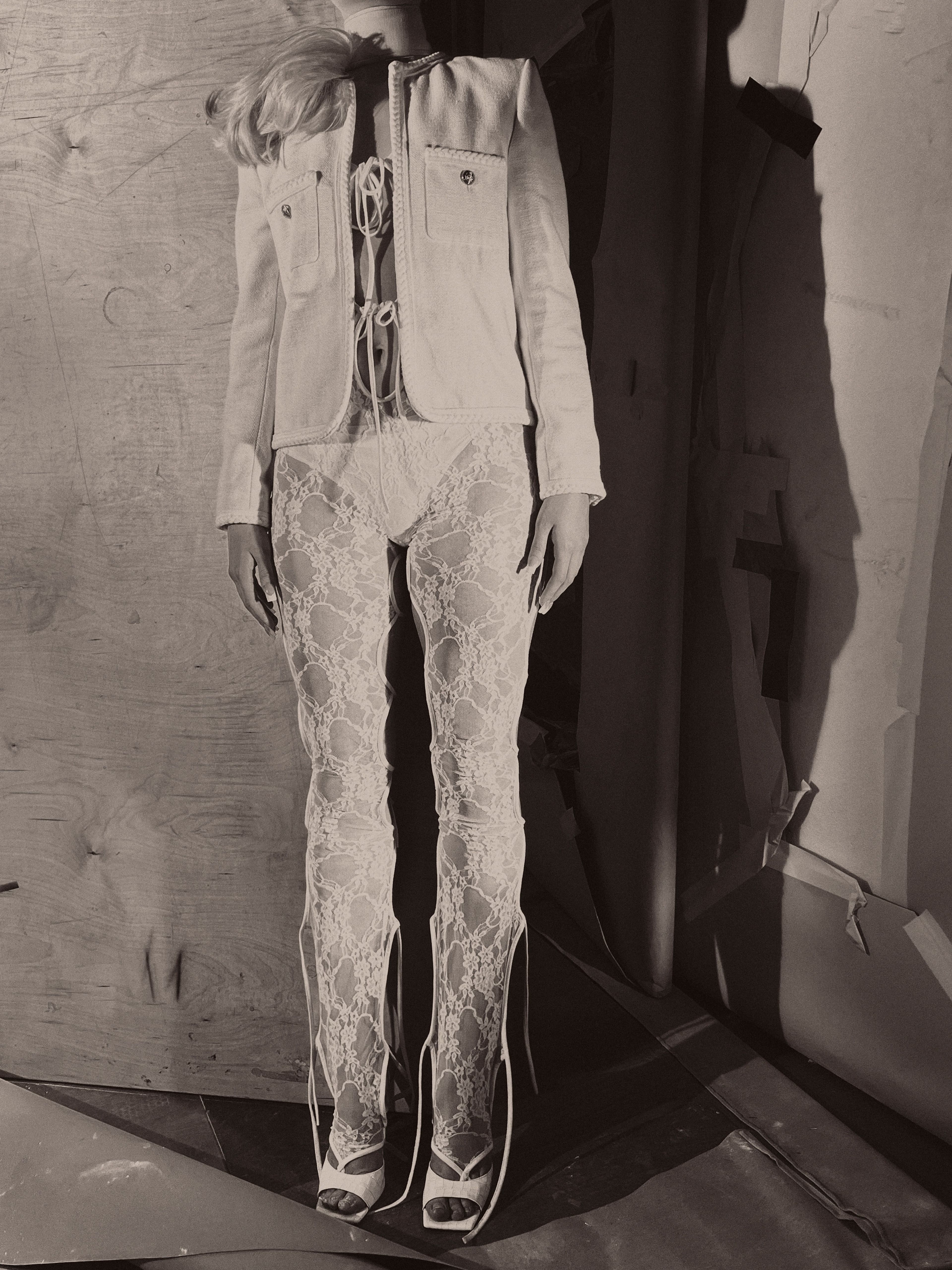 Jacket by Celine by Hedi Slimane. Bodysuit by Nicolas Guichard. Underwear by Wolford. Choker by Burberry. Shoes by The Attico.