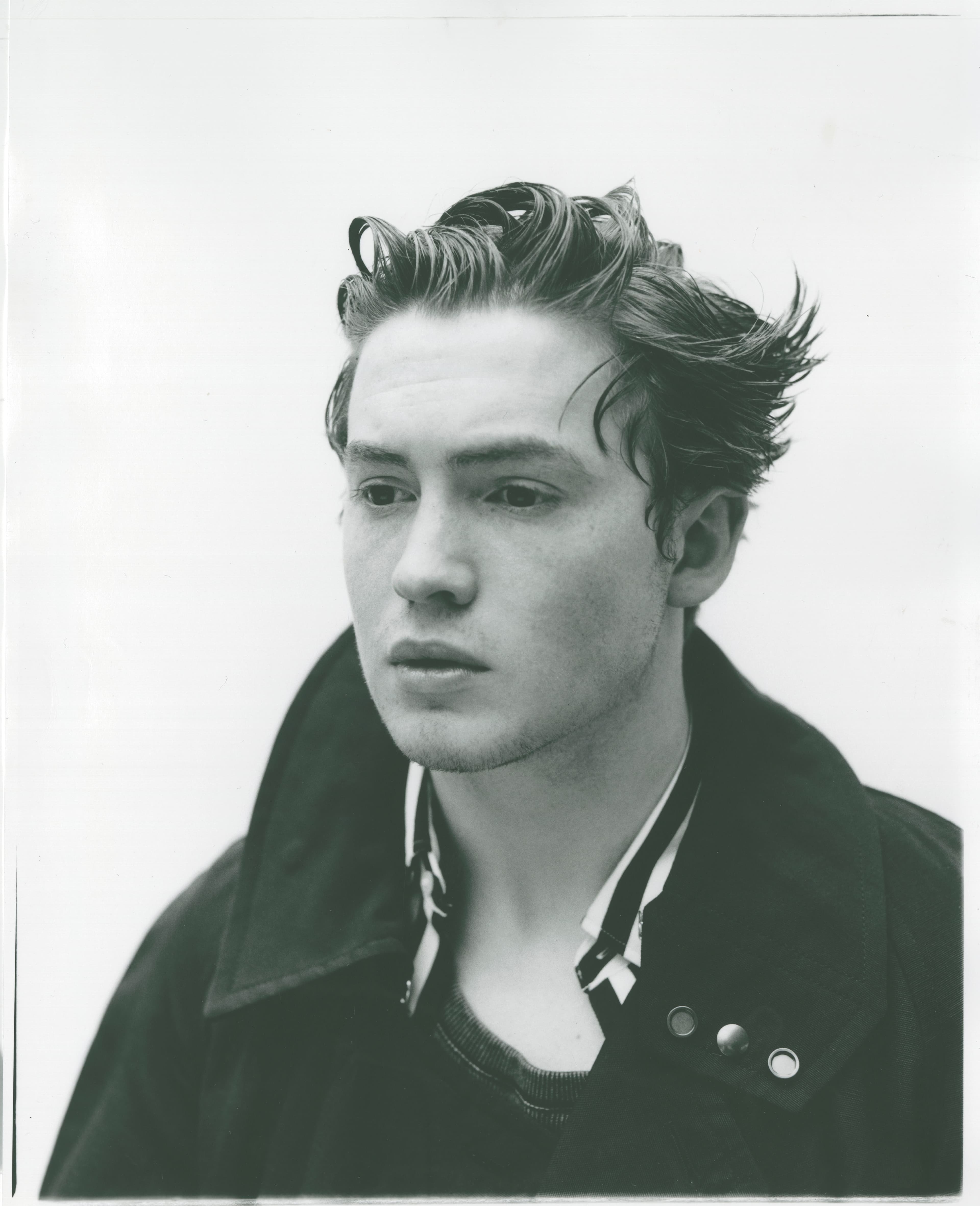 Coat and shirt by Salvatore Ferragamo. Tank top by Diesel.