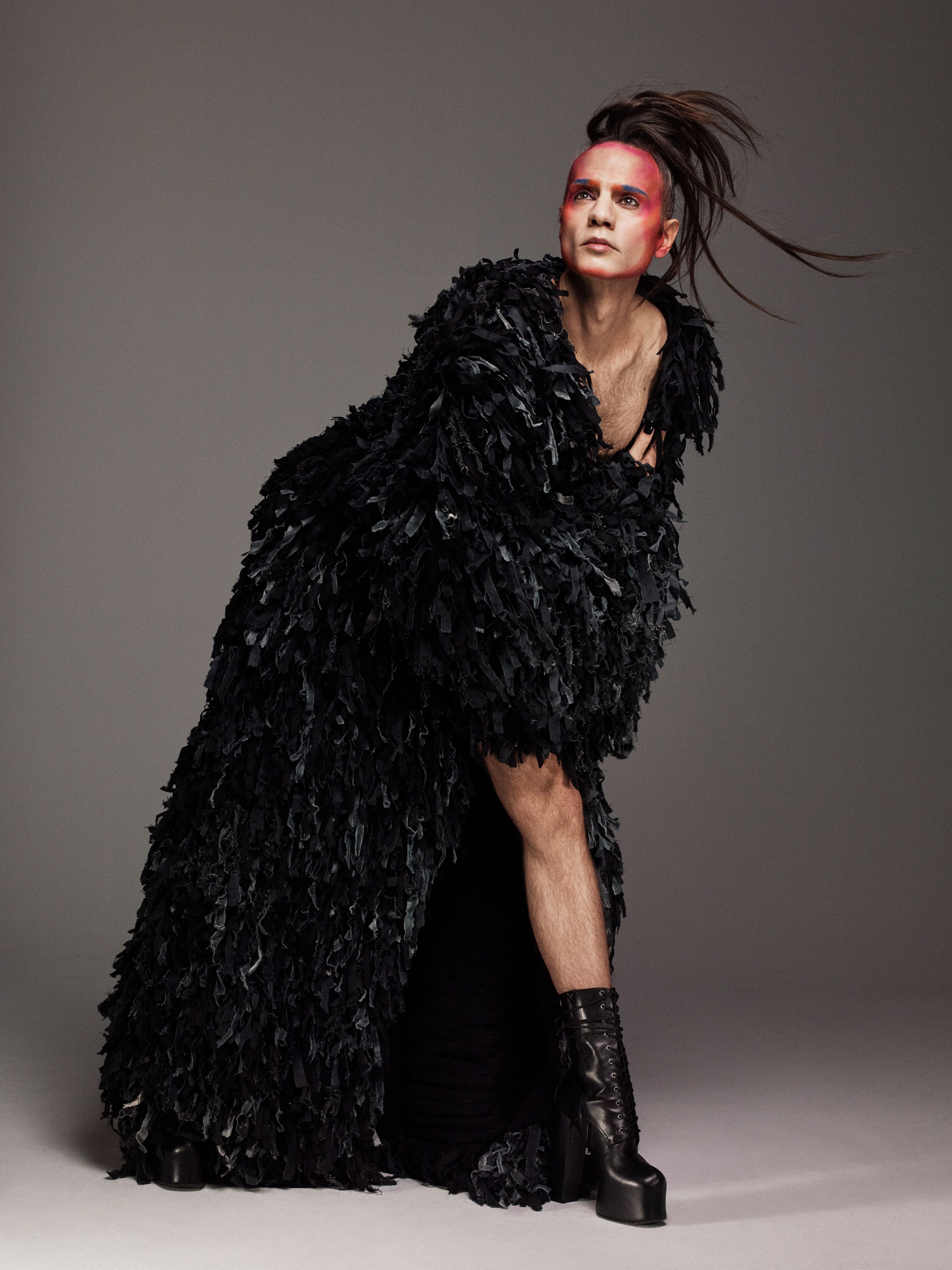 Coat by Yuze Lix. Boots by Saint Laurent.