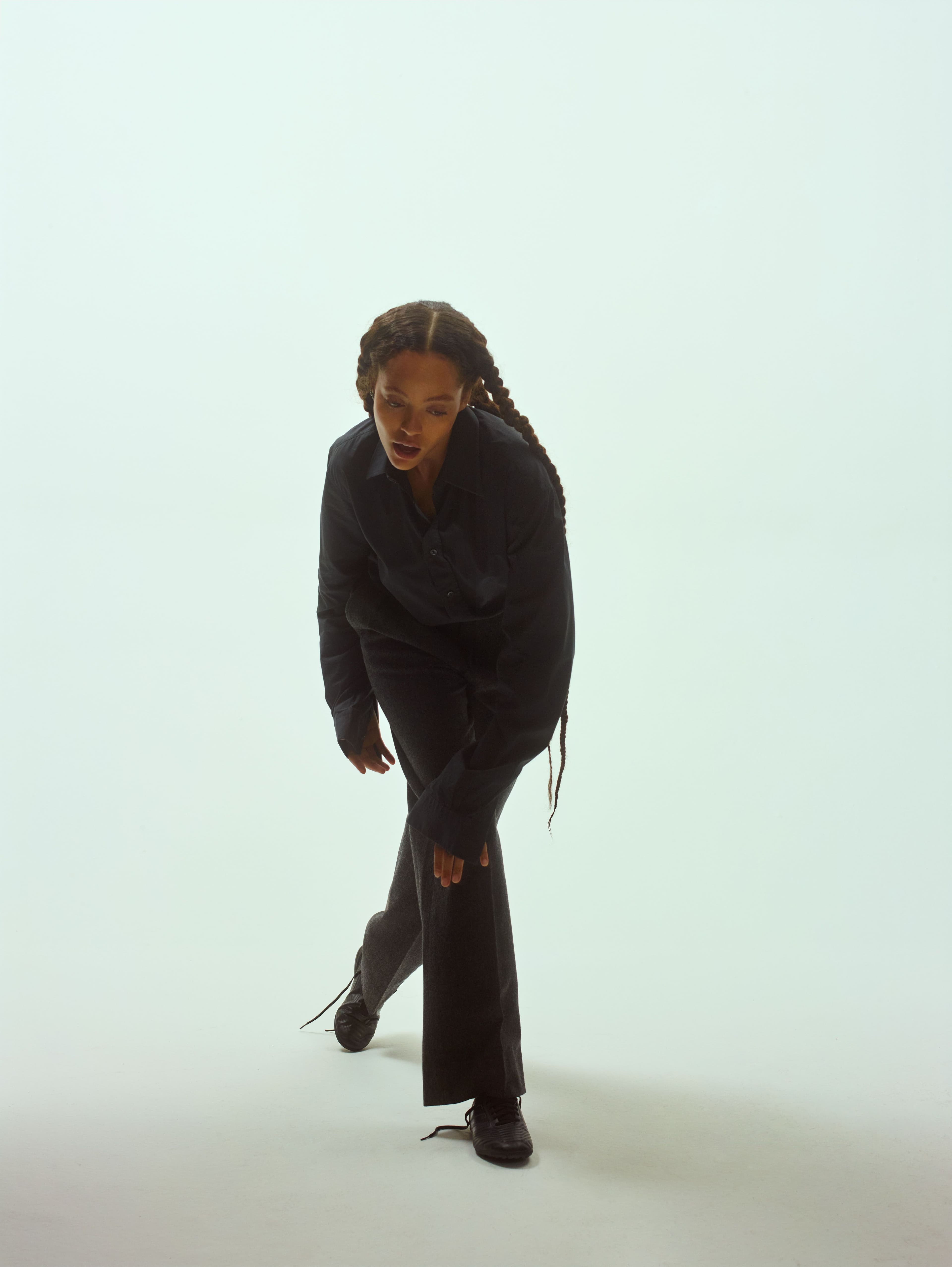 Vintage shirt by Hermès. Vintage pants by Saint Laurent. Vintage belt by Prada. Vintage sneakers by Adidas. All jewelry throughout, Swindell’s own.