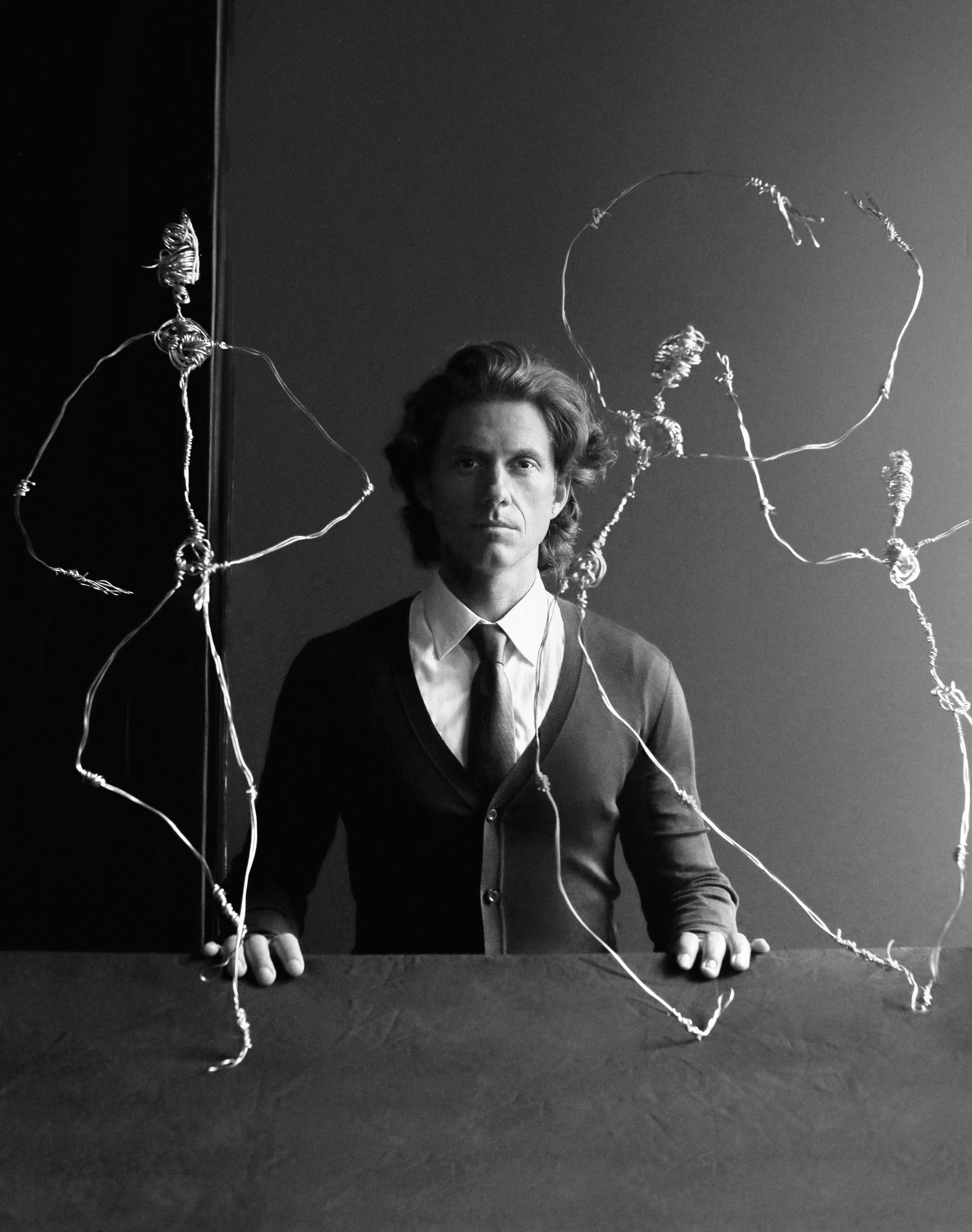 Jumpsuit by Prada. Shirt by Charvet. Tie by Hermès.