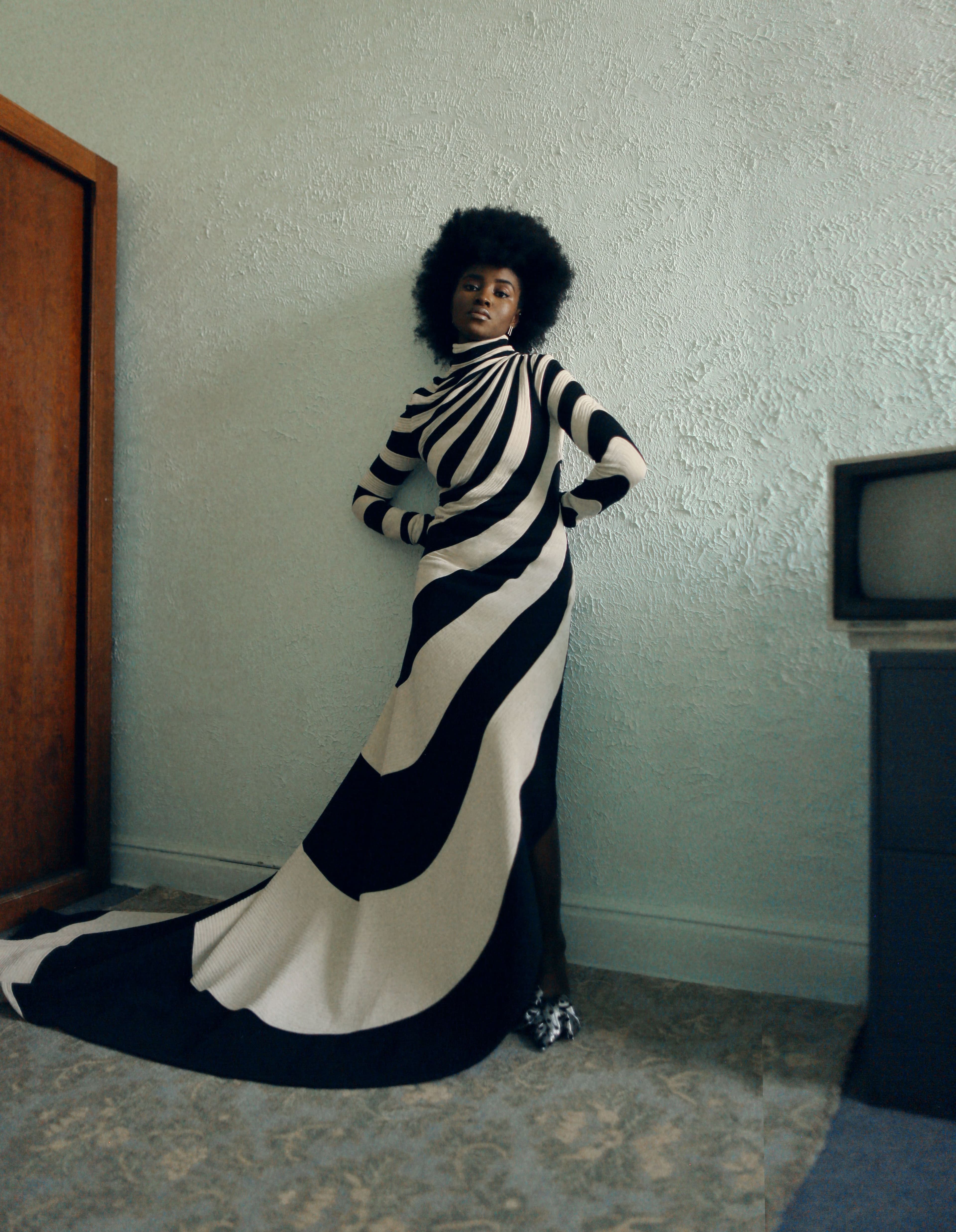 Dress by Marc Jacobs. Shoes by Balenciaga. Earrings by Eriness.