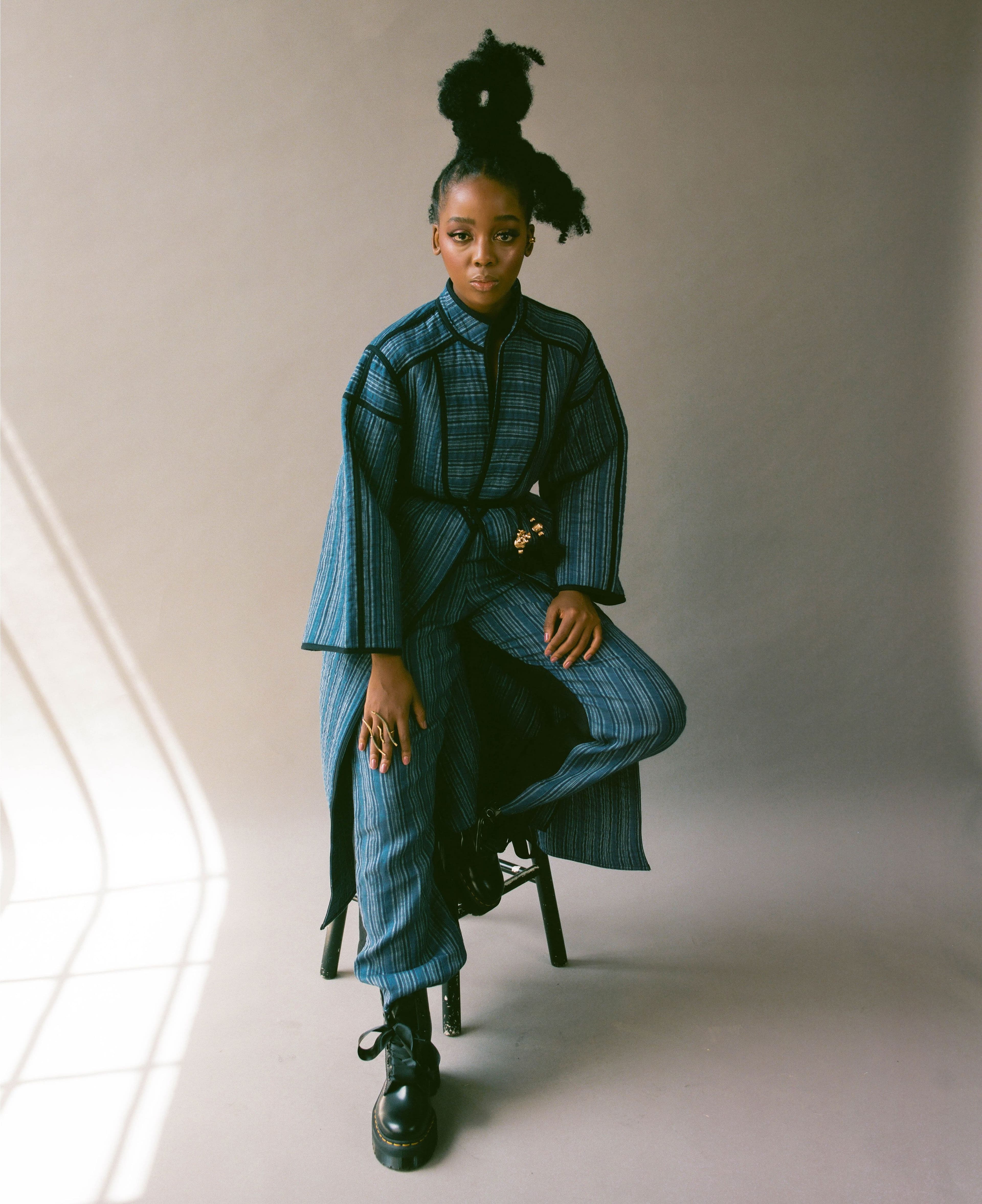 All clothing and belt by Tory Burch. Shoes by Dr. Martens. All jewelry by MISHO.