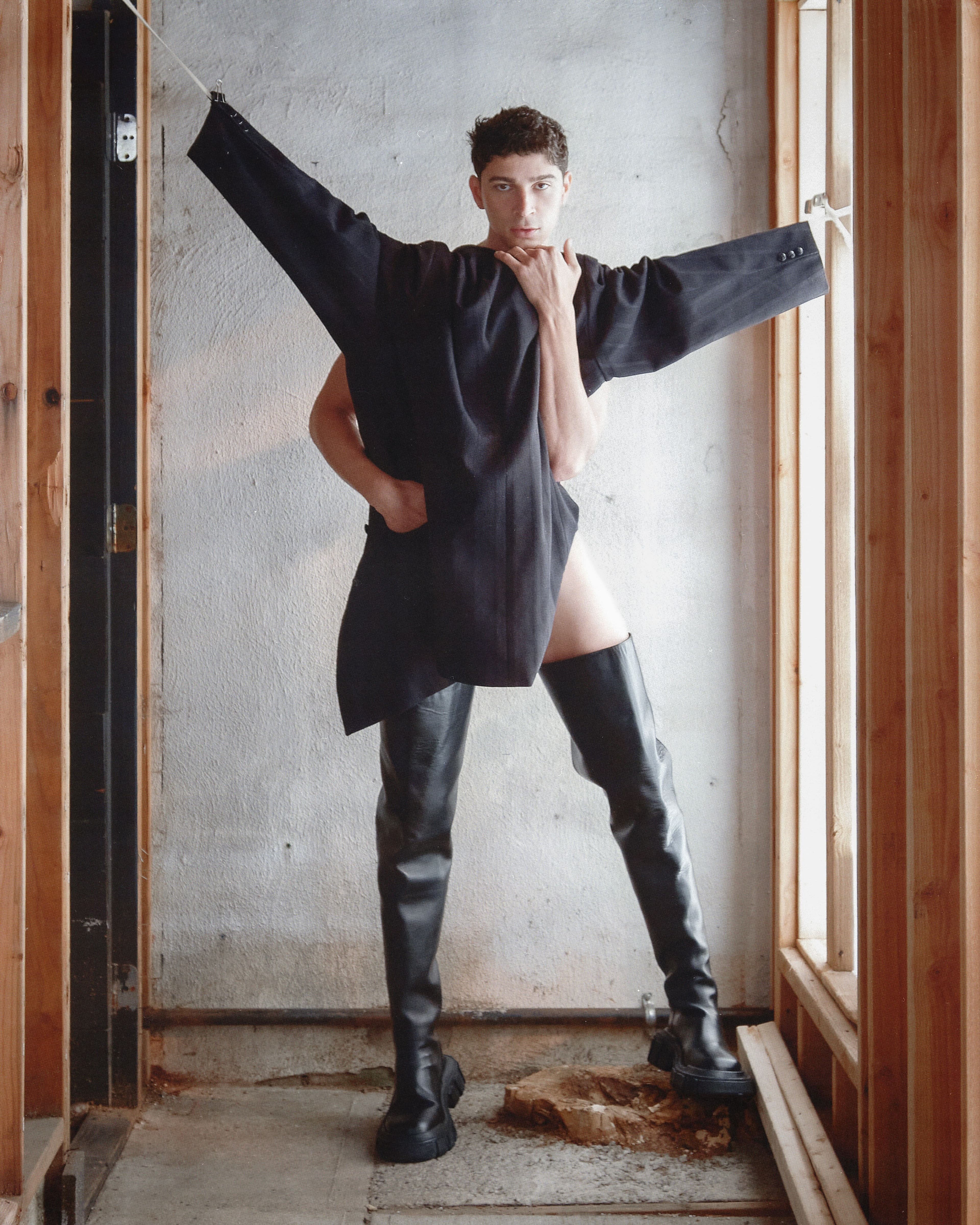 Jacket by Yohji Yamamoto. Boots by Dion Lee.