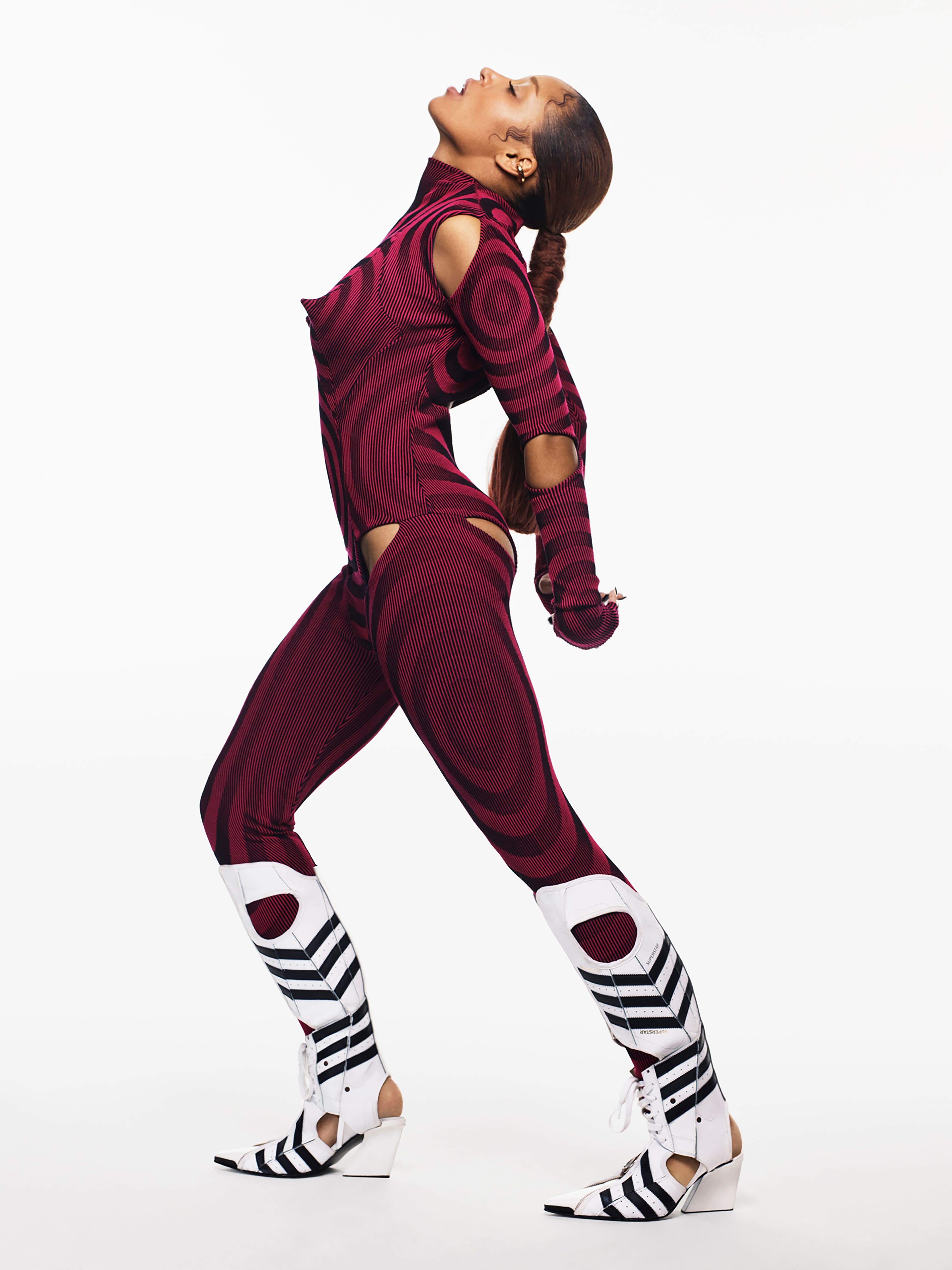 Bodysuit by Paolina Russo. Boots by Paolina Russo x Adidas x Marko Baković. Ear cuff by Jennifer Fisher.