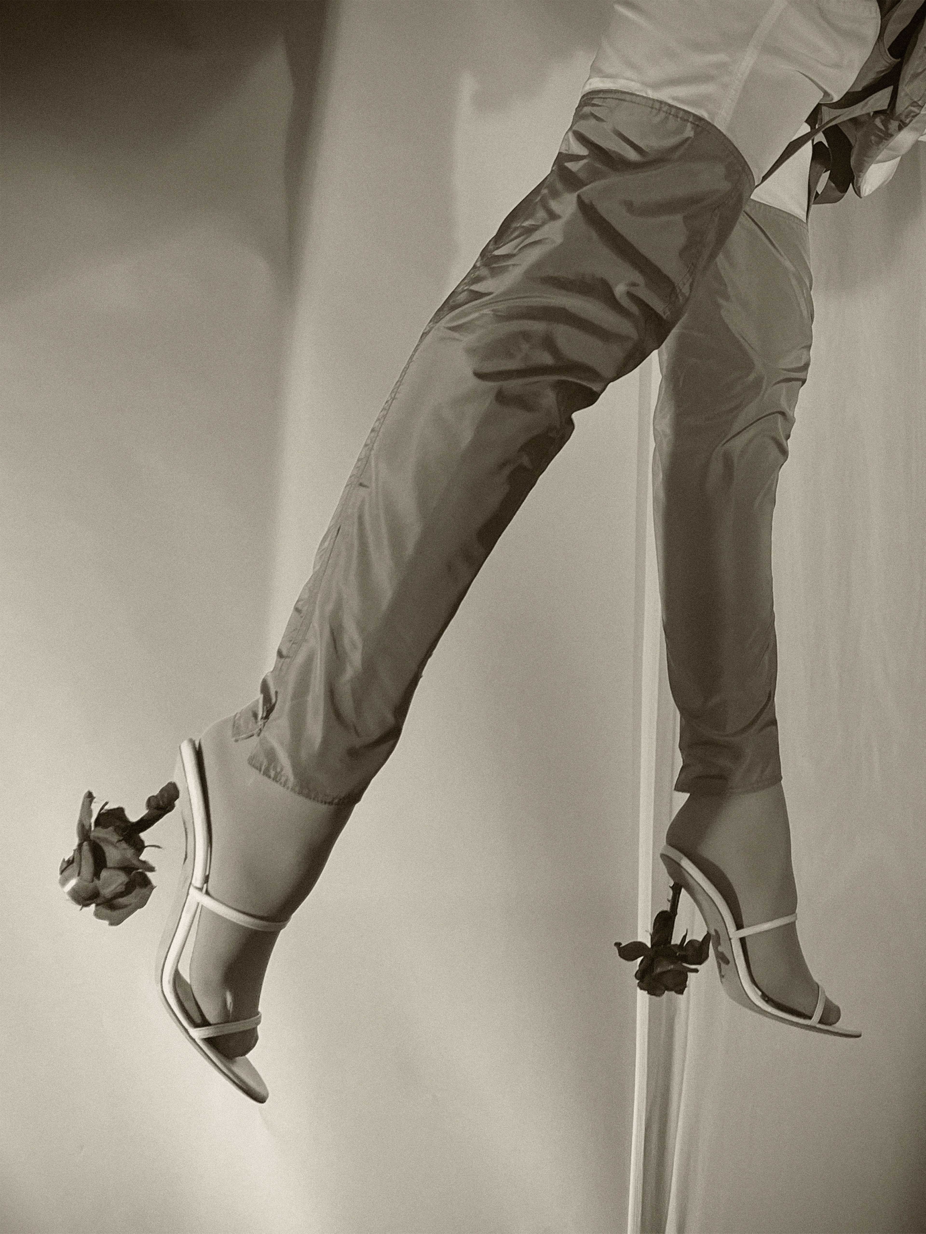 Pants and shoes by Loewe. Tights by Falke.