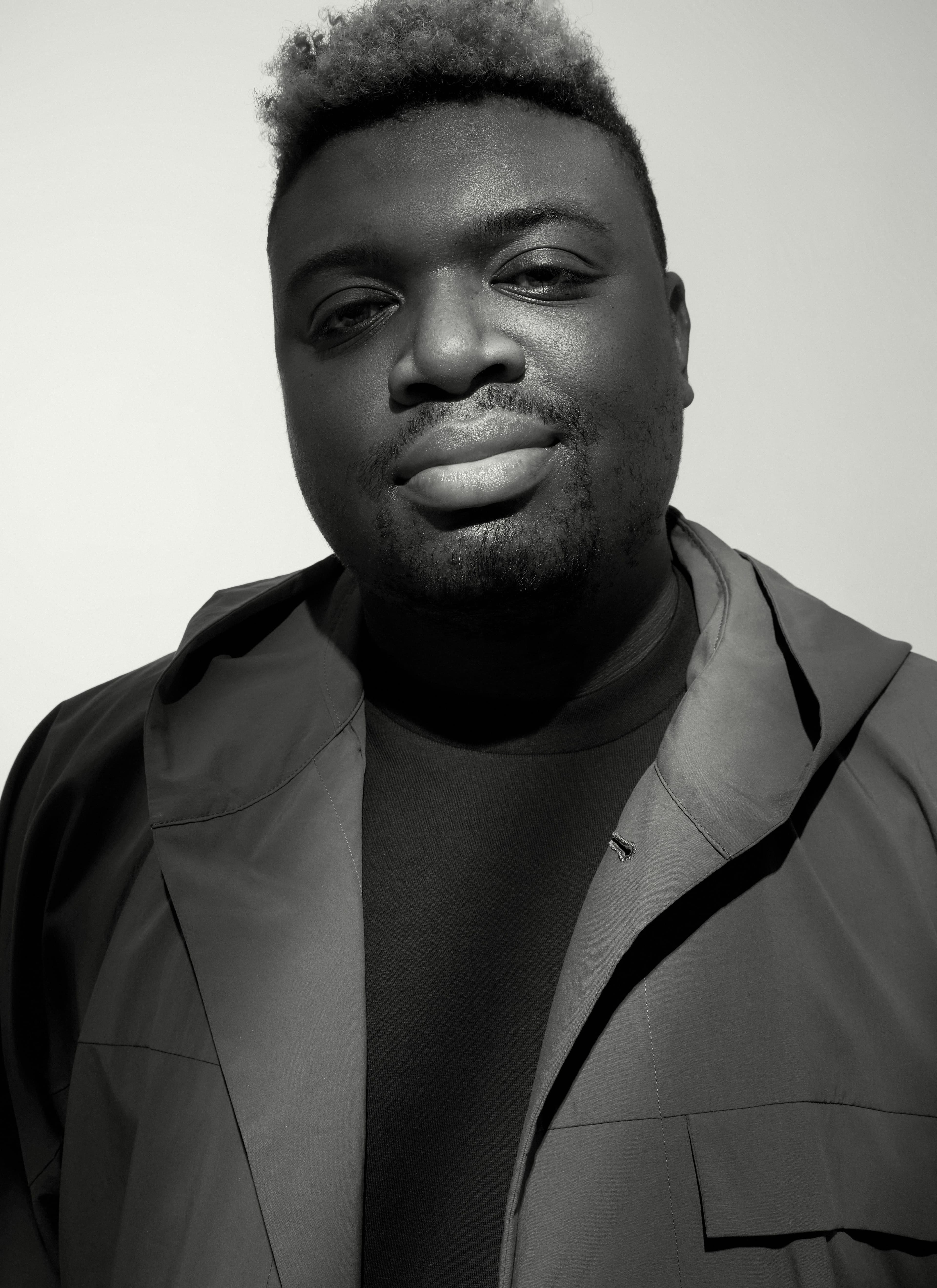 COAT by ,Homme Plis,s,é ,Issey Miyake., T-SHIRT by ,Druthers NYC.