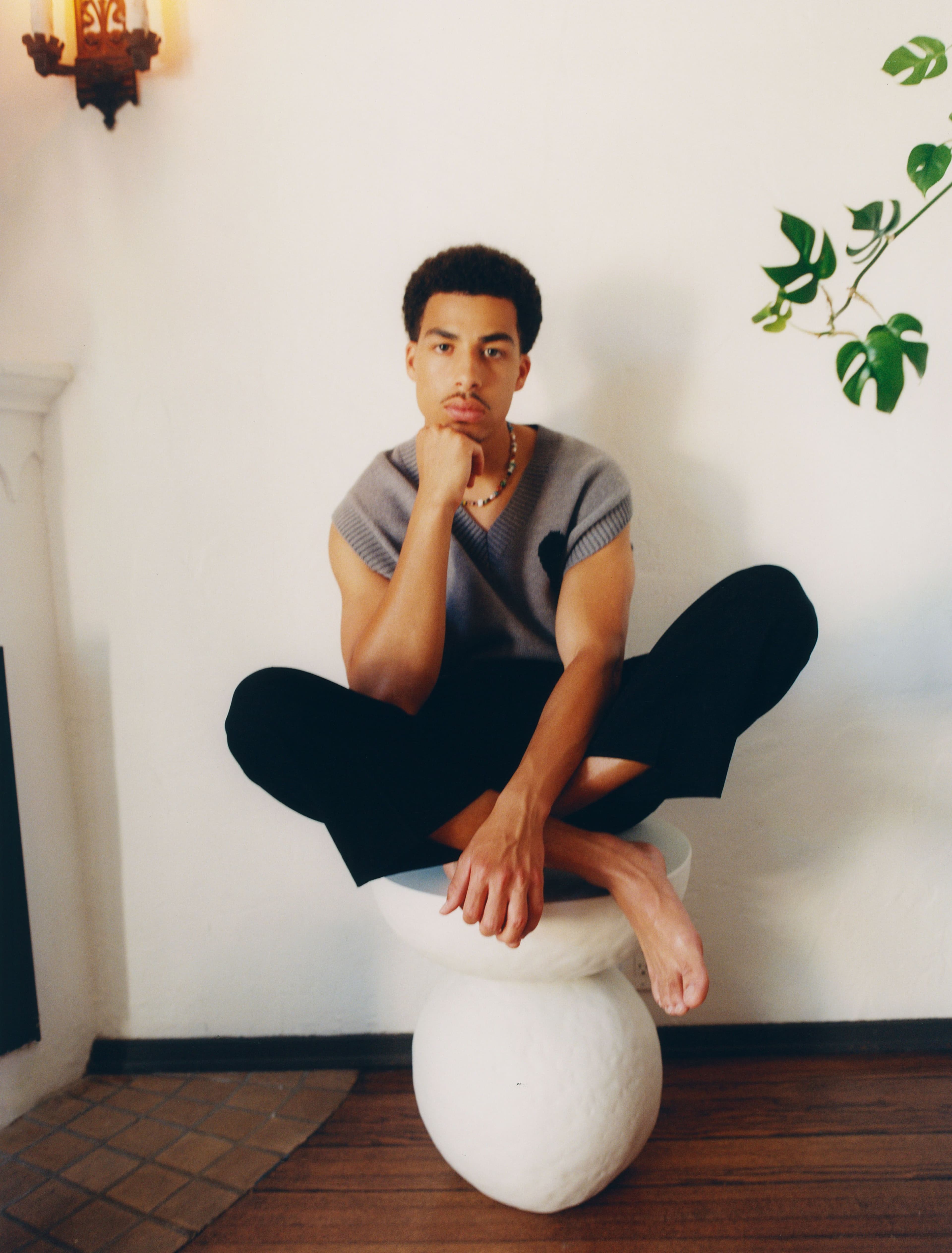 Top by AMI Paris. Pants, worn throughout, by Loewe.