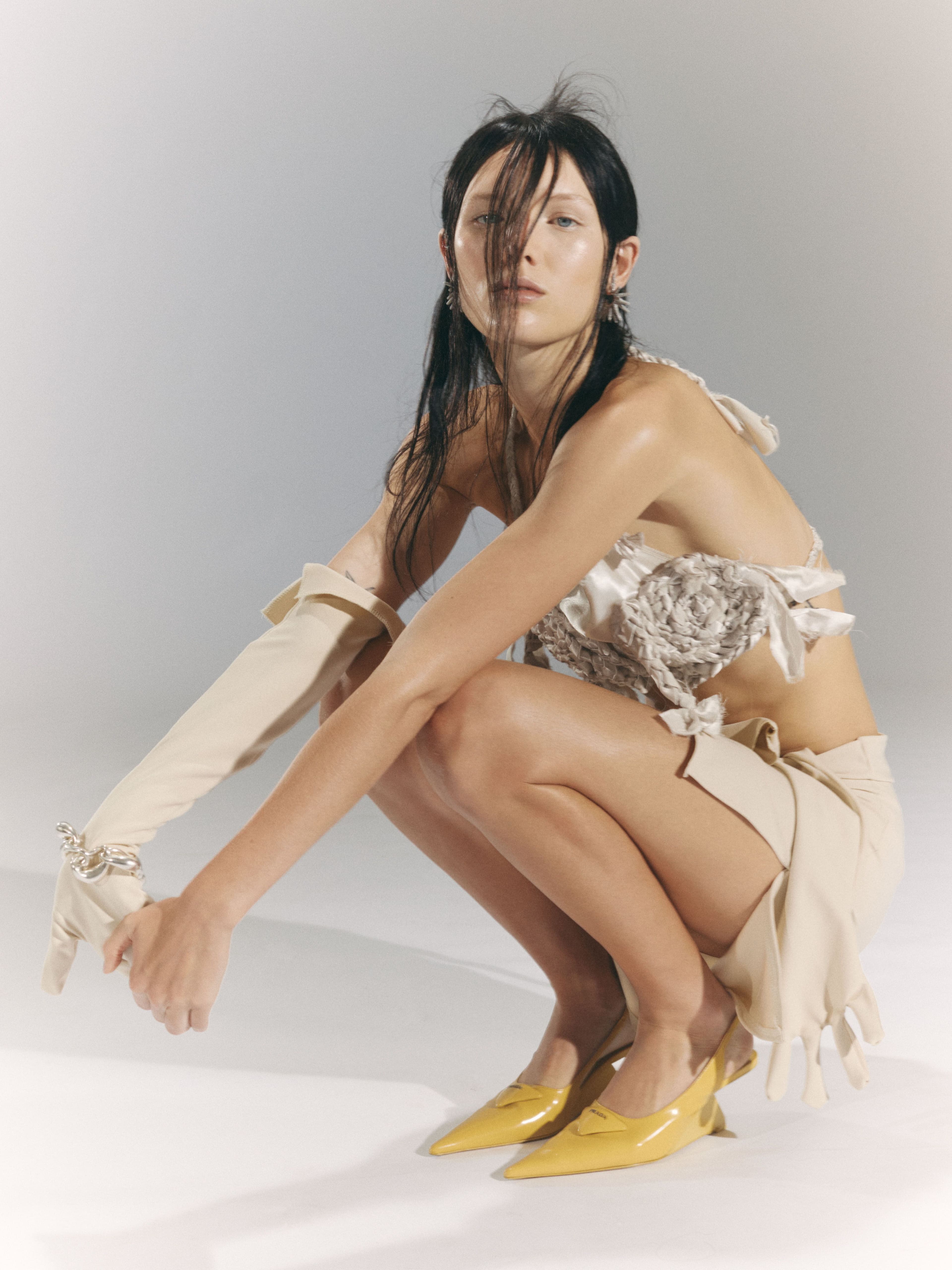 All clothing and gloves by Youkhana. Shoes by Prada. Earrings by Bottega Veneta. Bracelet by Louise Olsen.