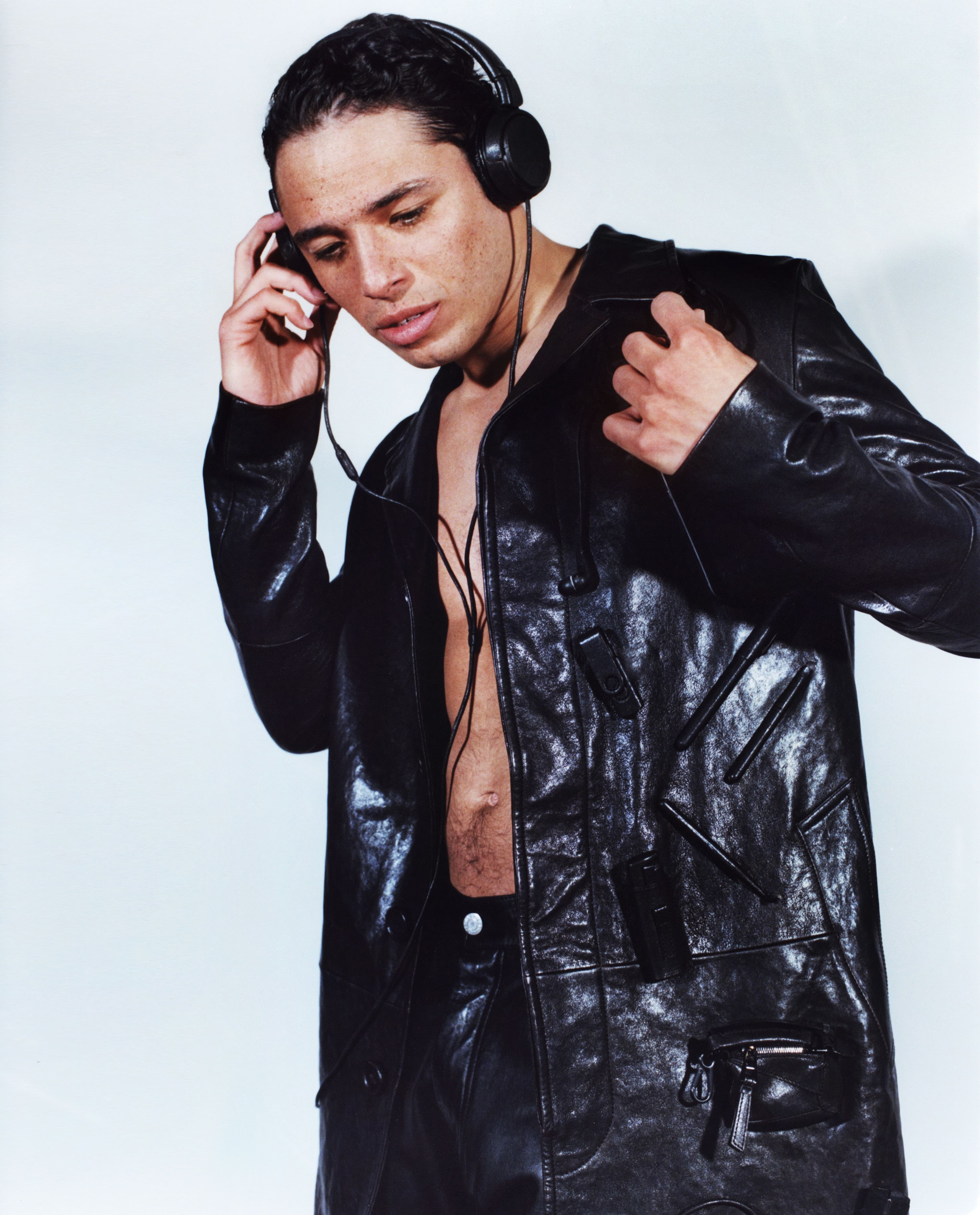 Coat and headphones by Loewe. Vintage pants by Helmut Lang from the David Casavant Archive.