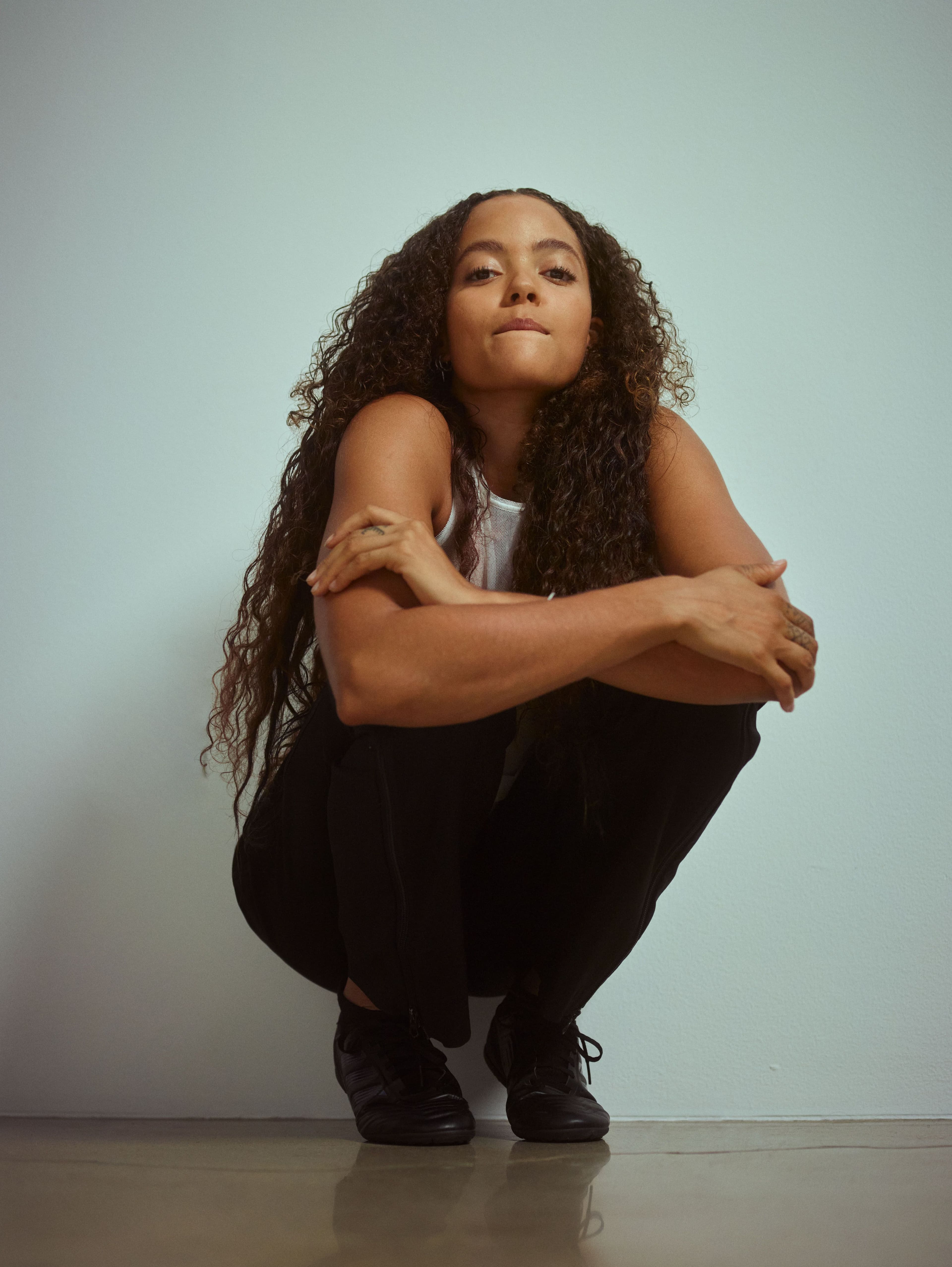 Vintage top by Helmut Lang. Vintage pants by Raf Simons. Vintage sneakers by Adidas.