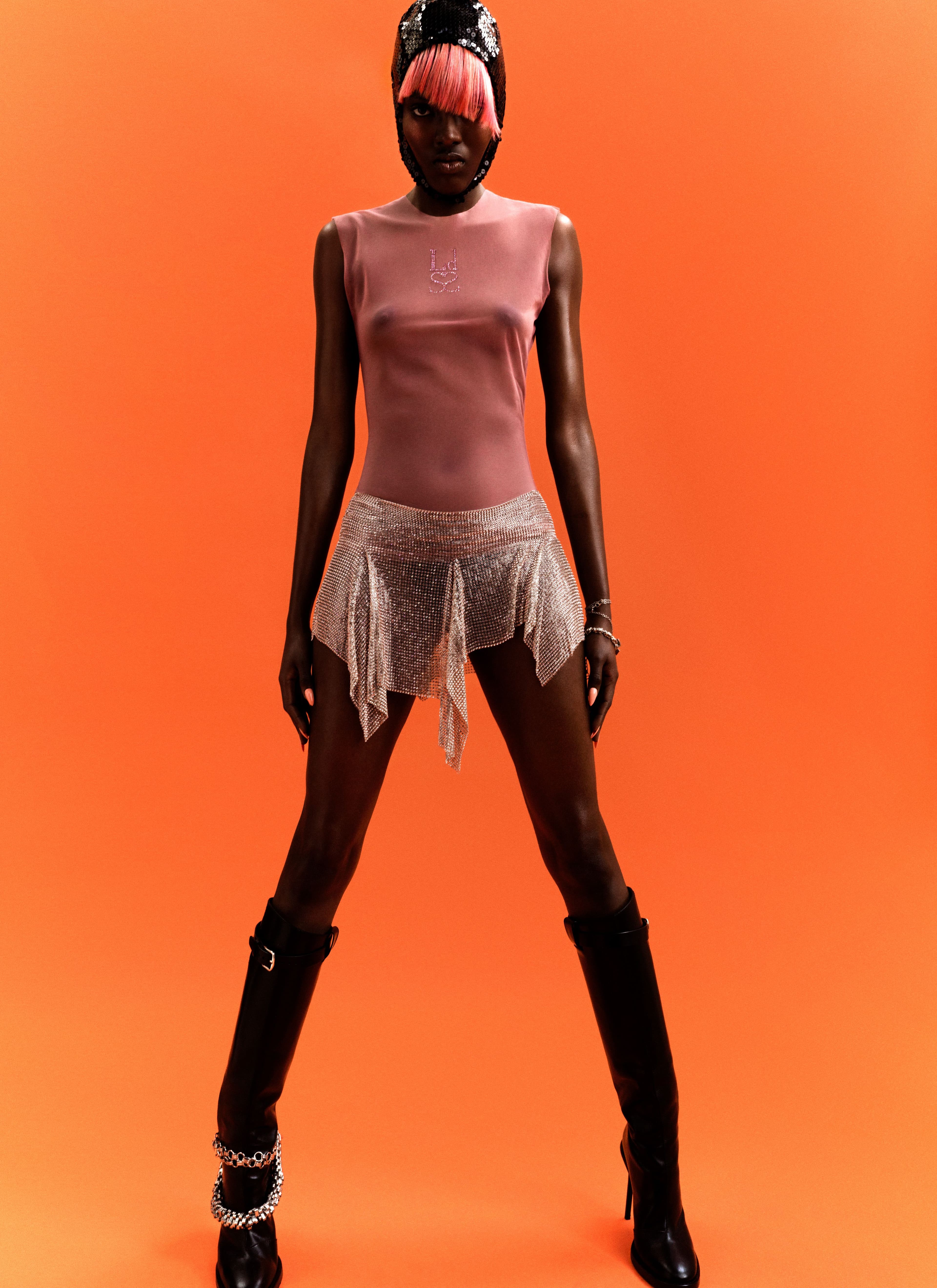 All clothing by Ludovic de Saint Sernin. Headpiece by Nina Ricci. Shoes by Ann Demeulemeester. All jewelry, stylist’s own.