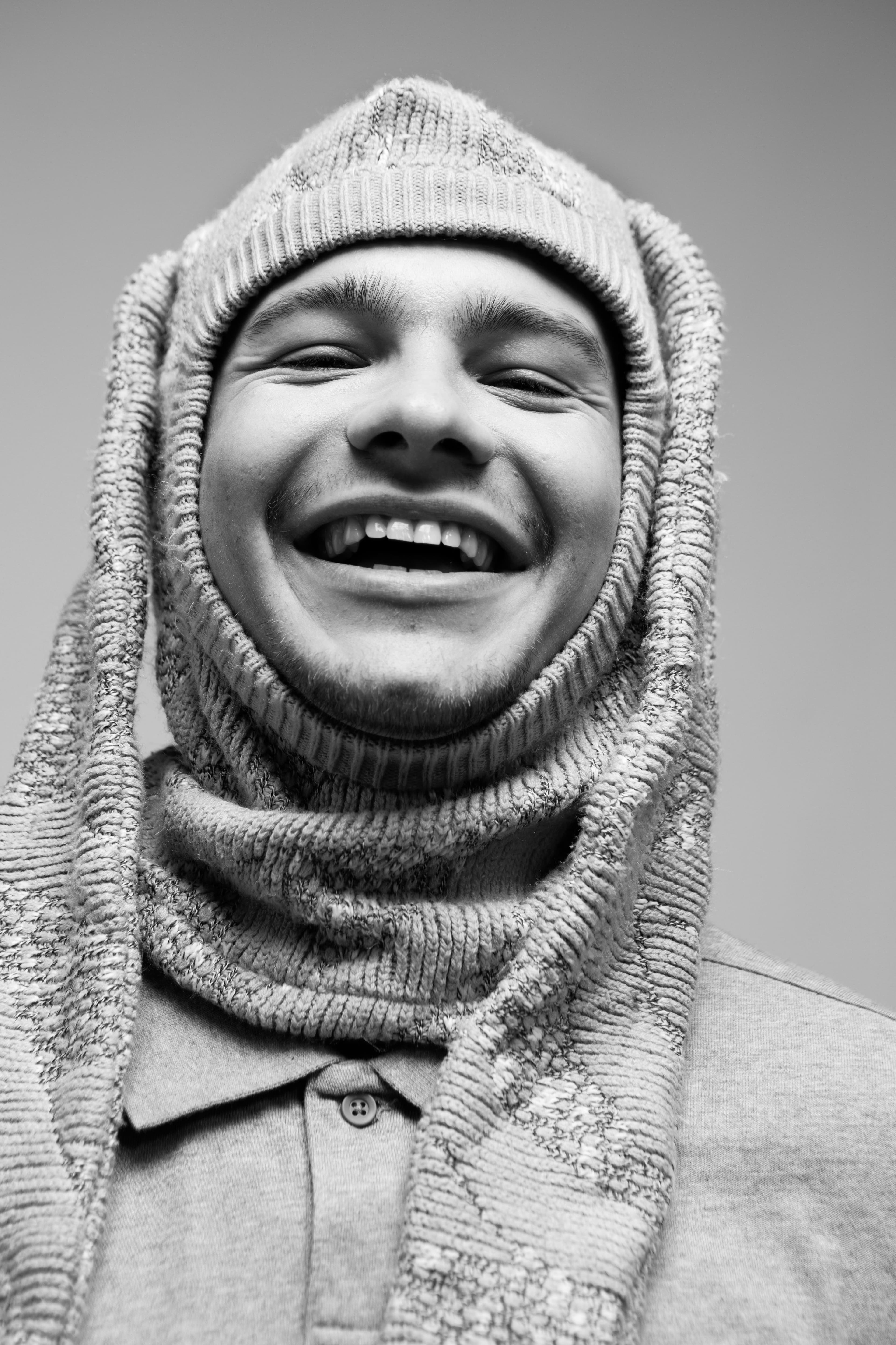 Polo shirt by Fear of God Essentials. Balaclava by Ms. Maskie.