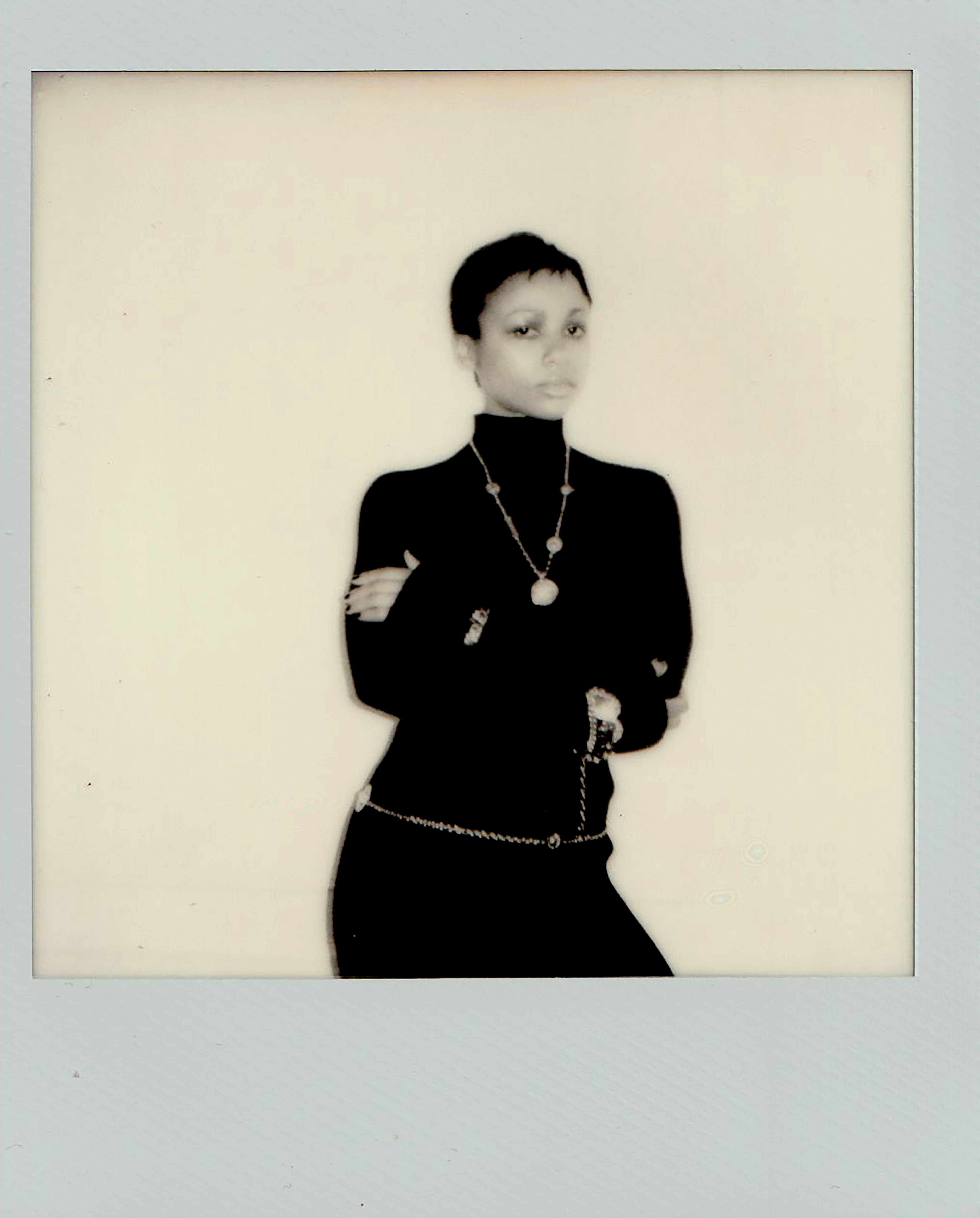 DRESS and CHAINS by ,Chanel. ,EARRINGS and RING, Myha’la’s own.